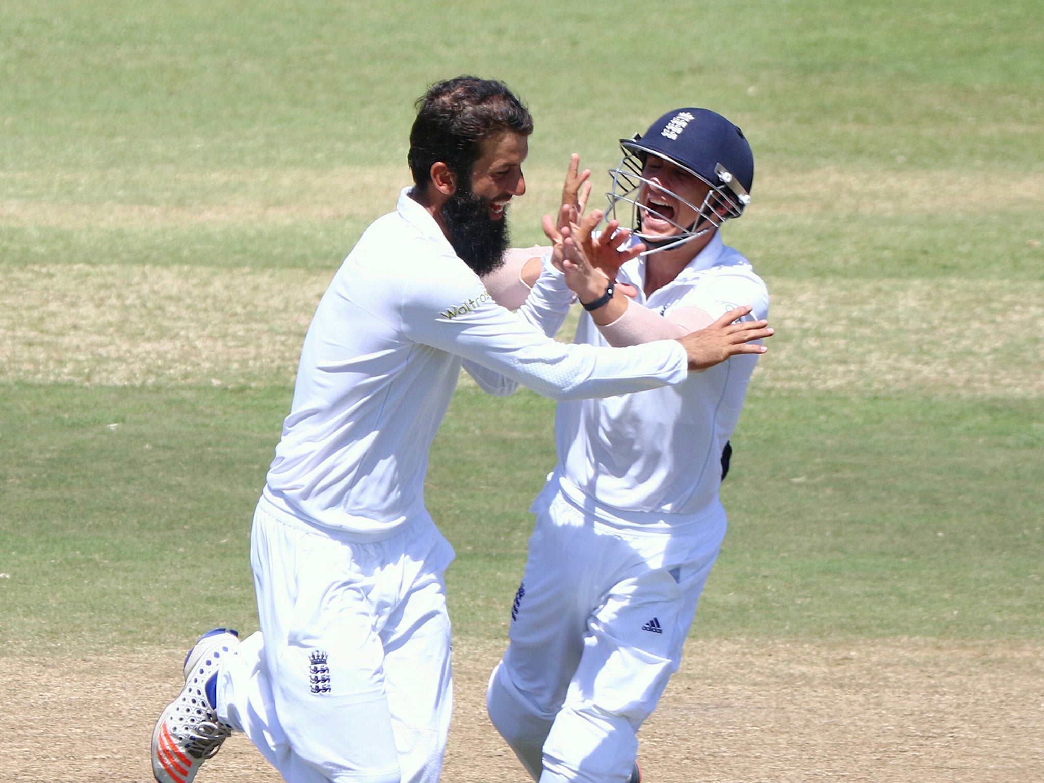 Moeen Ali and James Taylor celebrate the fall of AB de Villiers' wicket