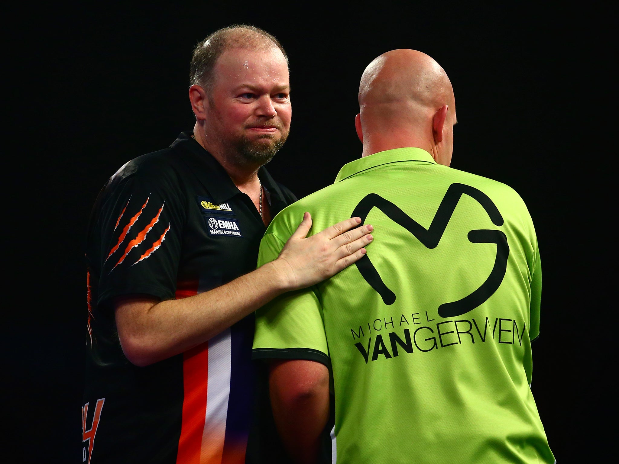 Raymond van Barneveld offers commiserations to Michael van Gerwen after his shock win