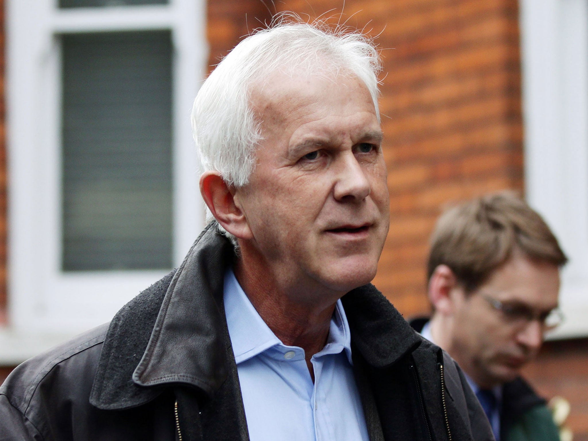 Environment Agency chairman Sir Philip Dilley leaves his flat in Marylebone, London, after arriving back in the country following a sunshine holiday in the Caribbean