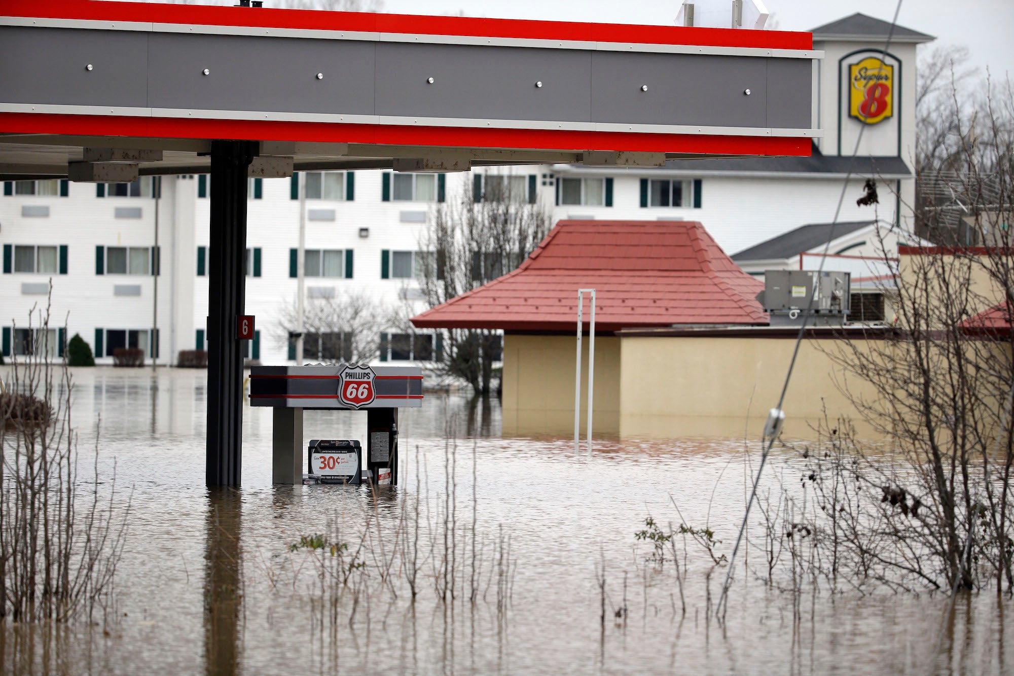 Floodwater from the Bourbeuse River surrounds businesses on December 29, 2015, in Union, Missouri.