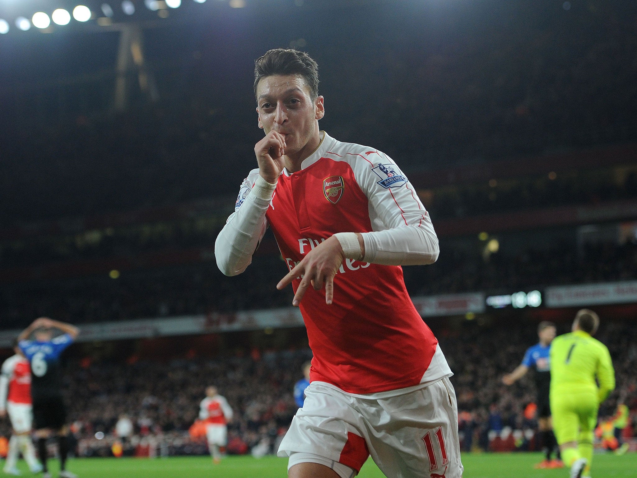 Mesut Ozil celebrates his goal against Bournemouth last Monday