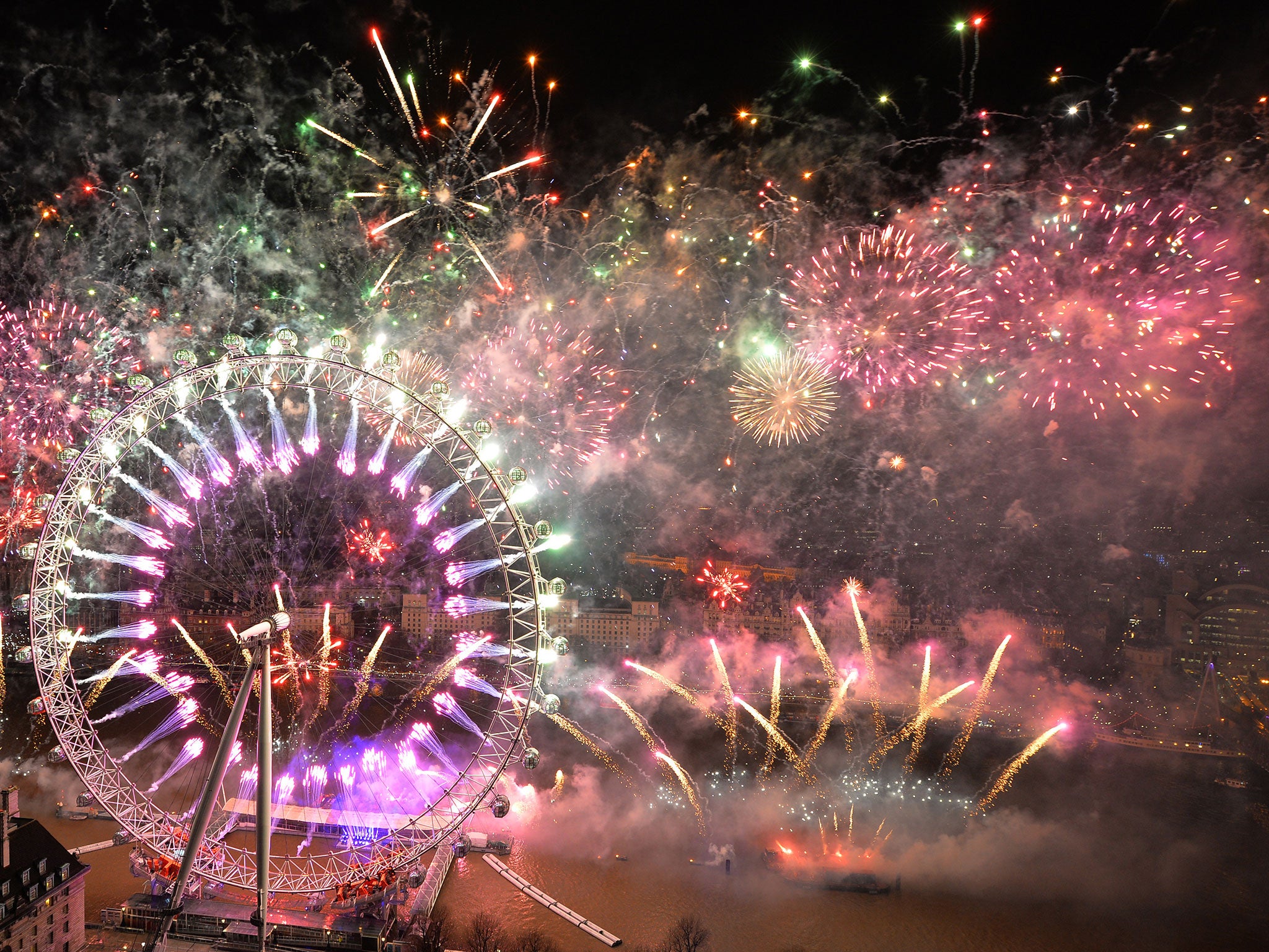 Fireworks explode over the London Eye