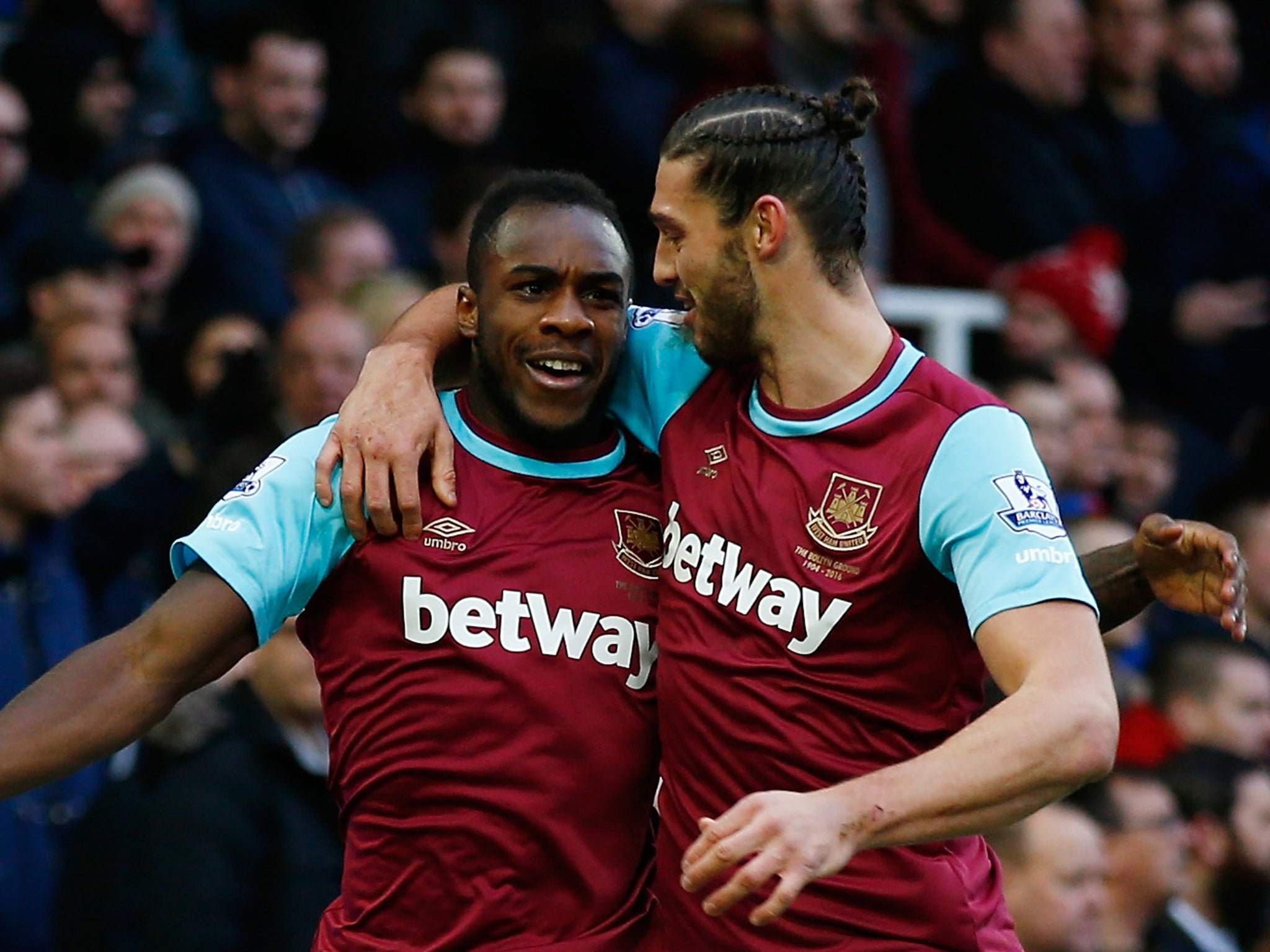 Michail Antonio celebrates with Andy Carroll after opening the scoring