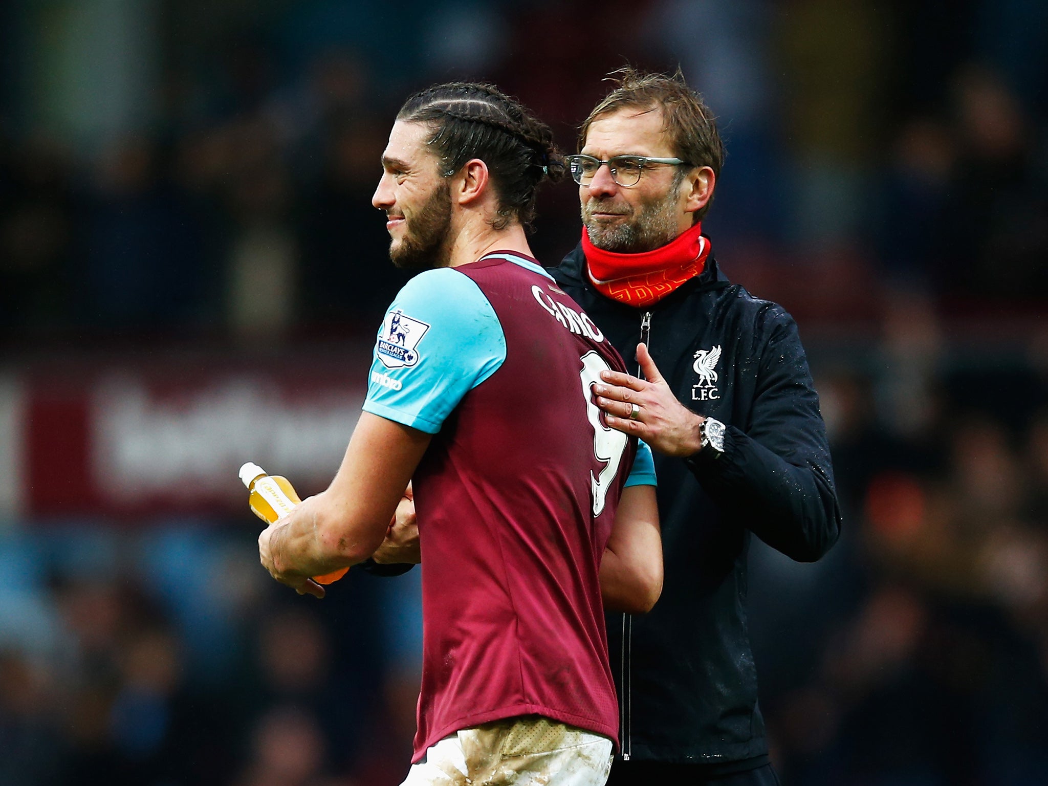 Liverpool manager Jurgen Klopp greets Andy Carroll after the match