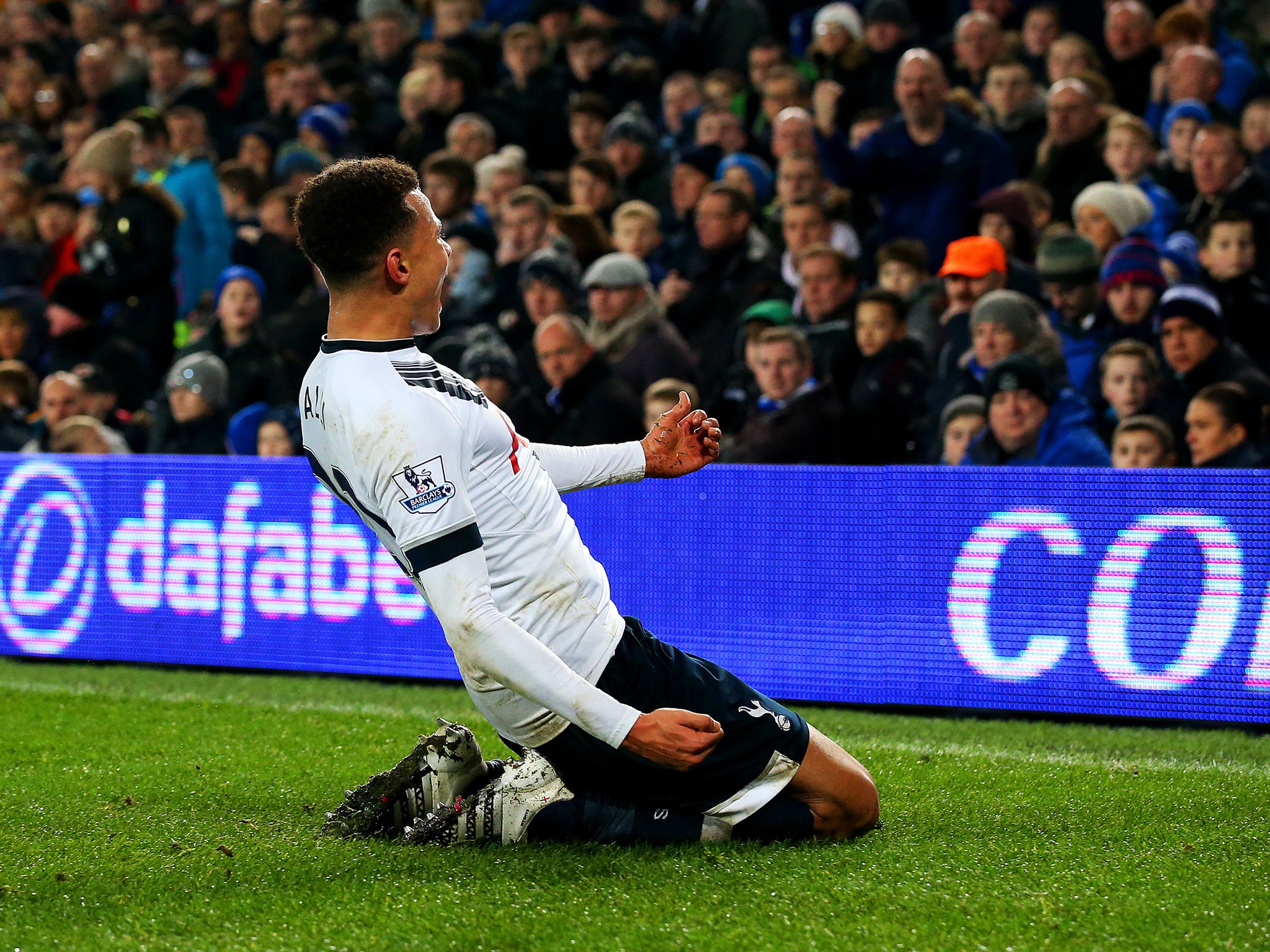 Dele Alli celebrates his equaliser at Goodison Park