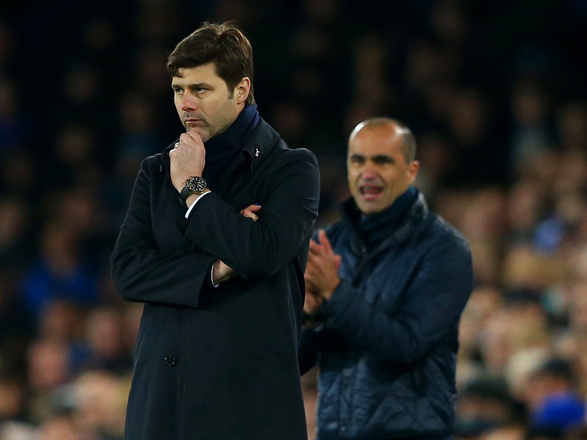 Mauricio Pochettino and Roberto Martinez watch on