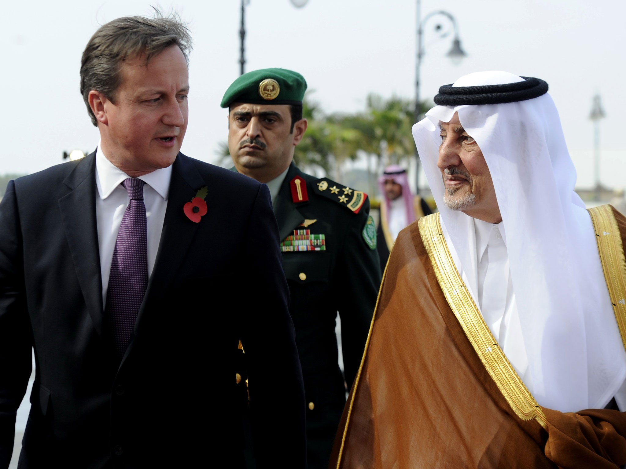 Prince Khalid bin Faisal bin Abdulaziz, right, with British Prime Minister David Cameron