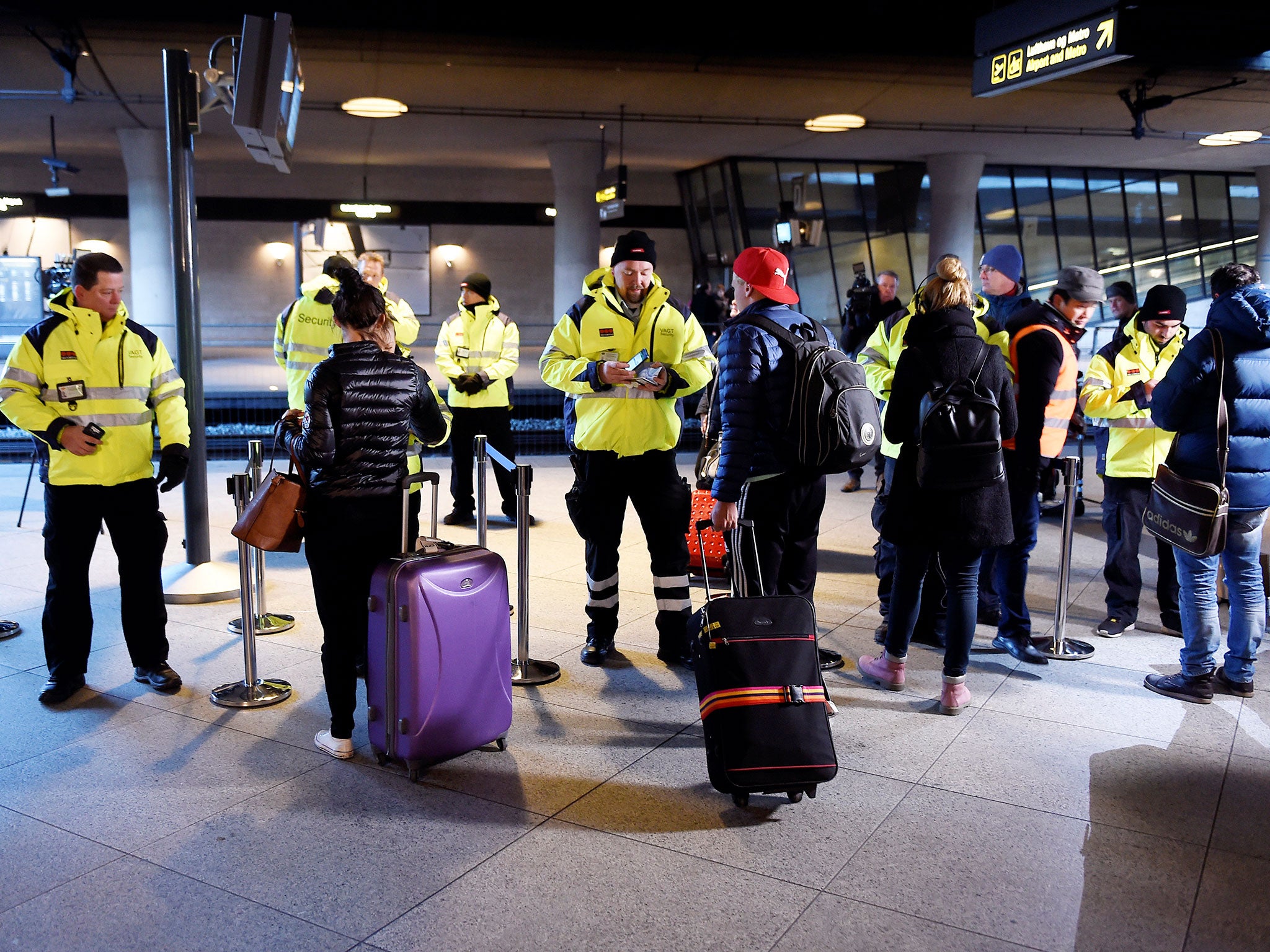 Security staff check passengers’ documents at Kastrups railway station outside Copenhagen. Some 17,000 commuters cross between Malmo in Sweden and the Danish capital every day