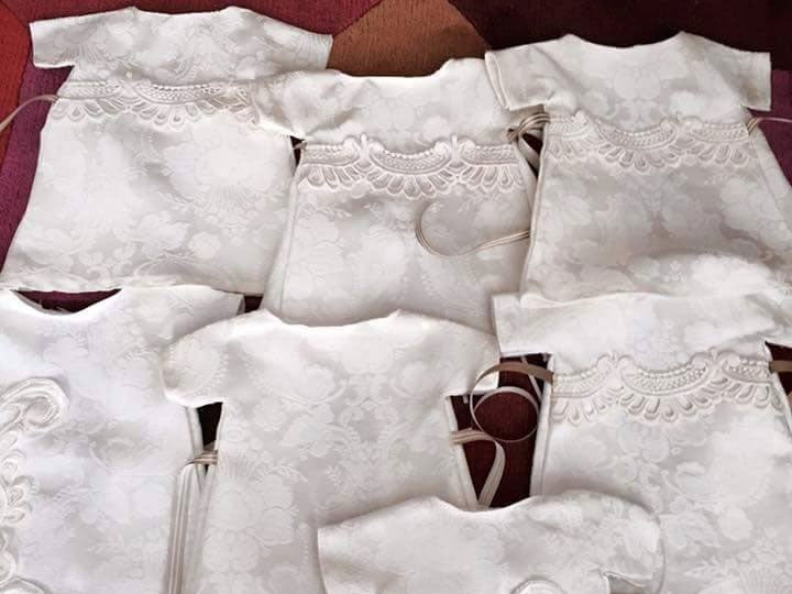 Some of the gowns that were made from Ms Trimble's donated wedding dress