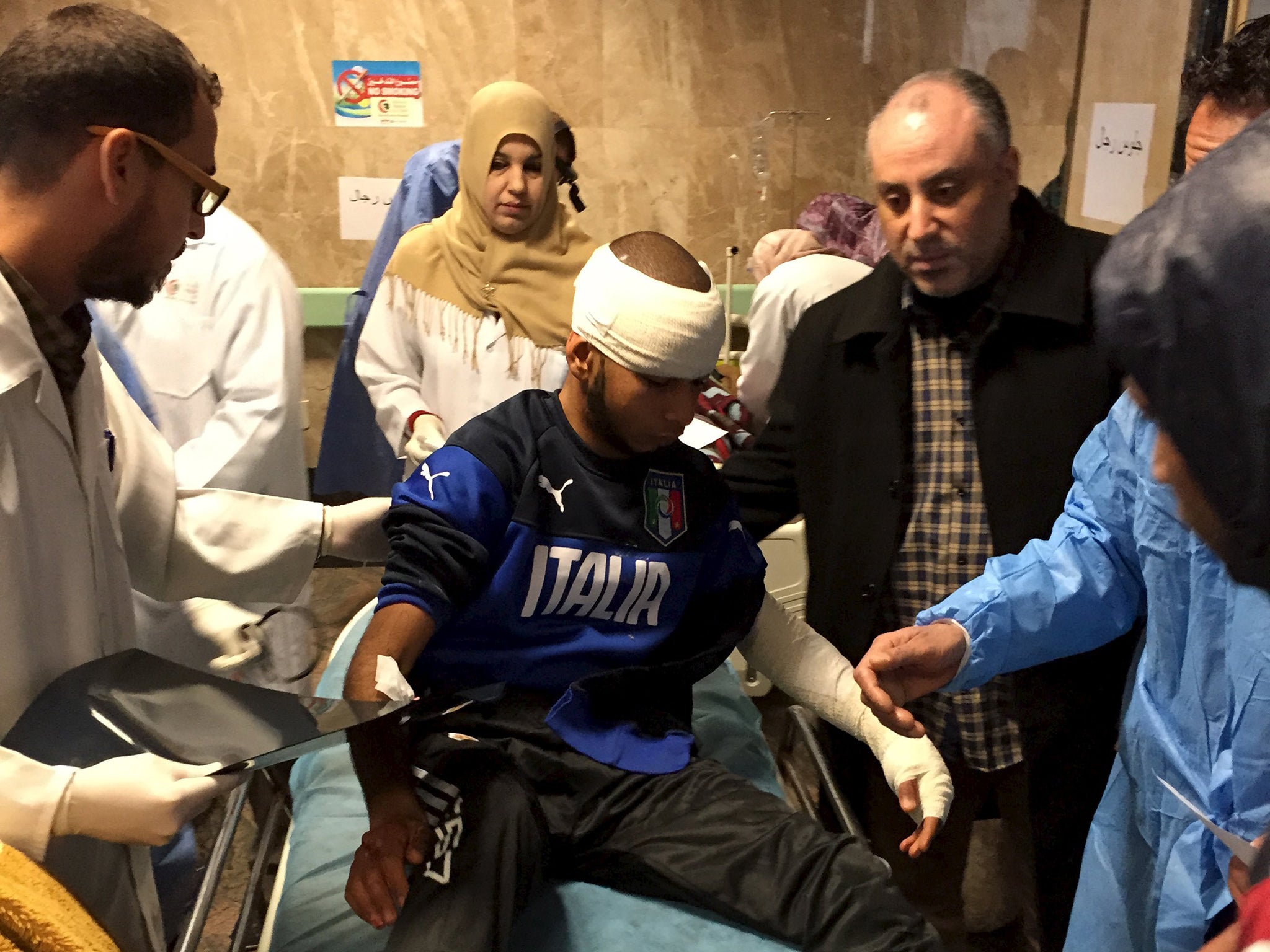 An injured man receives treatment inside a hospital in Misurata, after one of Libya's worst truck bombs in years exploded at a police training centre in the town of Zliten