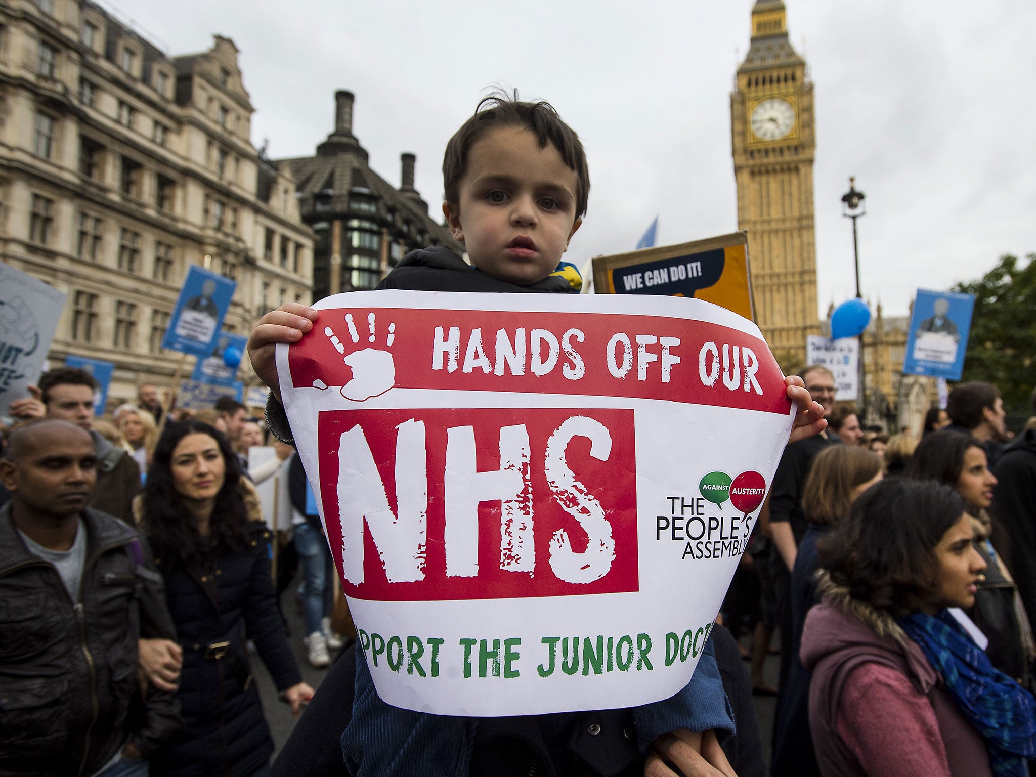 Thousands of doctors take part in a demonstration in Westminster, central London in support of junior doctors over changes to NHS contracts