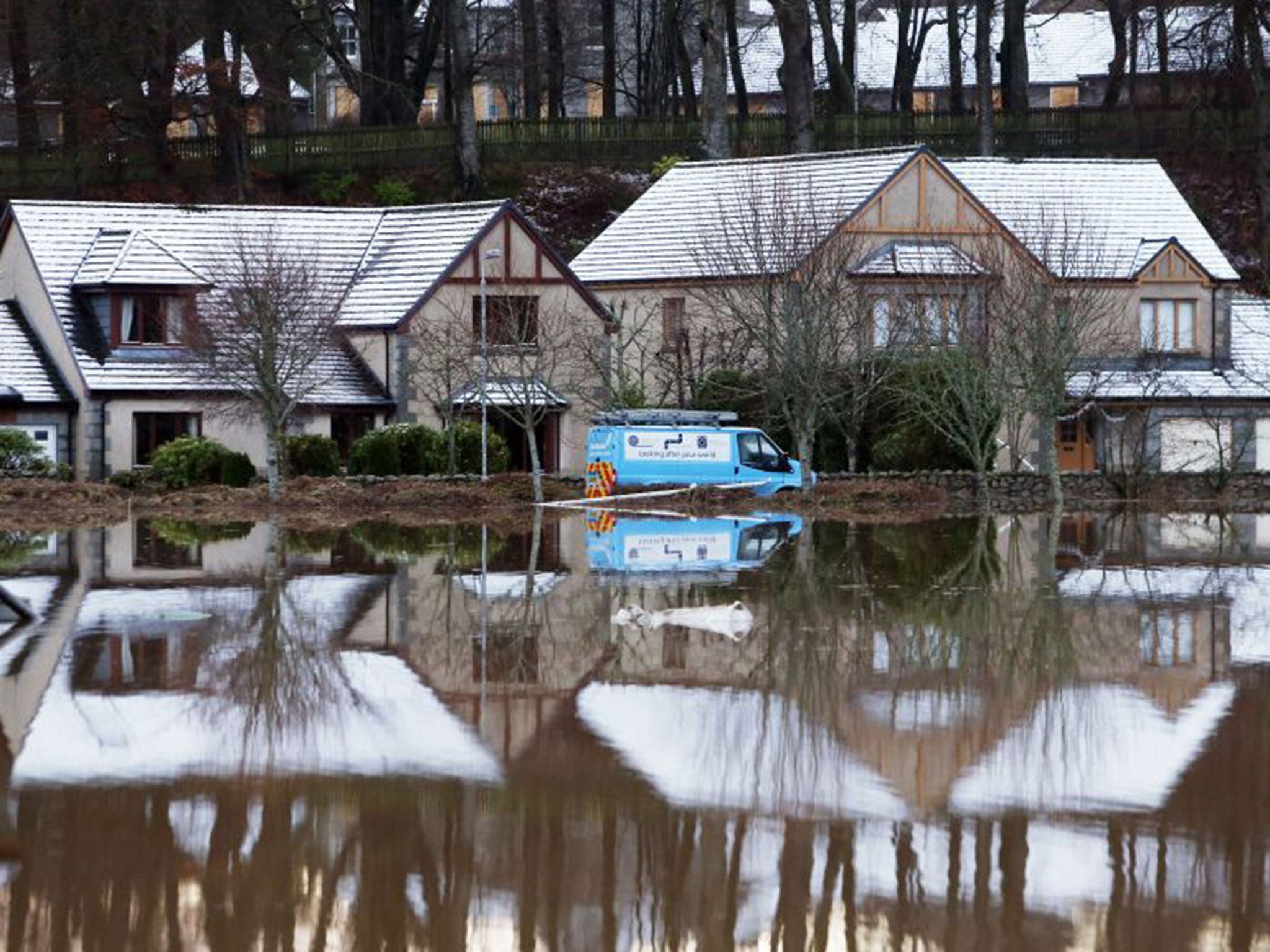 Flooded houses at Port Elphinstone, near Aberdeen, this morning after the River Don burst its banks.