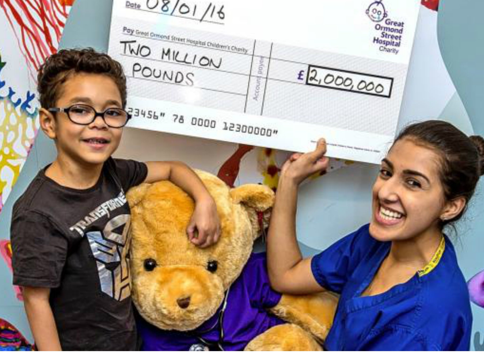 Raising a cheer: GOSH patient Marley Scott, 7, celebrates with healthcare assistant Faiza Yasin