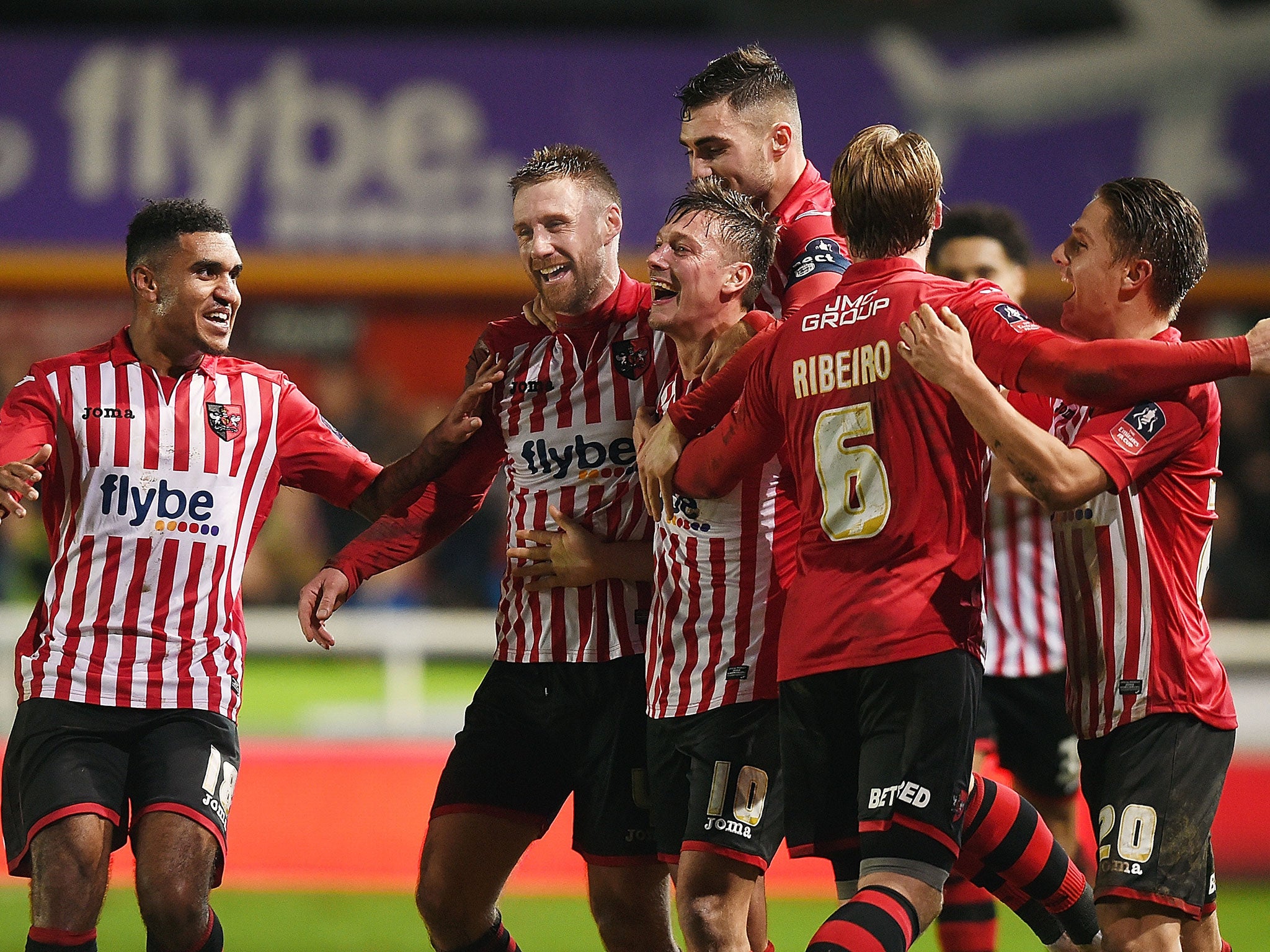 Holmes celebrates scoring from a corner