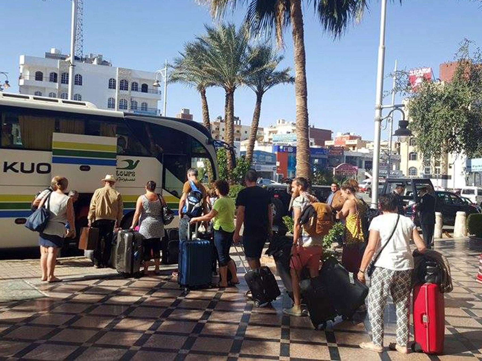 Tourists leave the Bella Vista Hotel following the attack