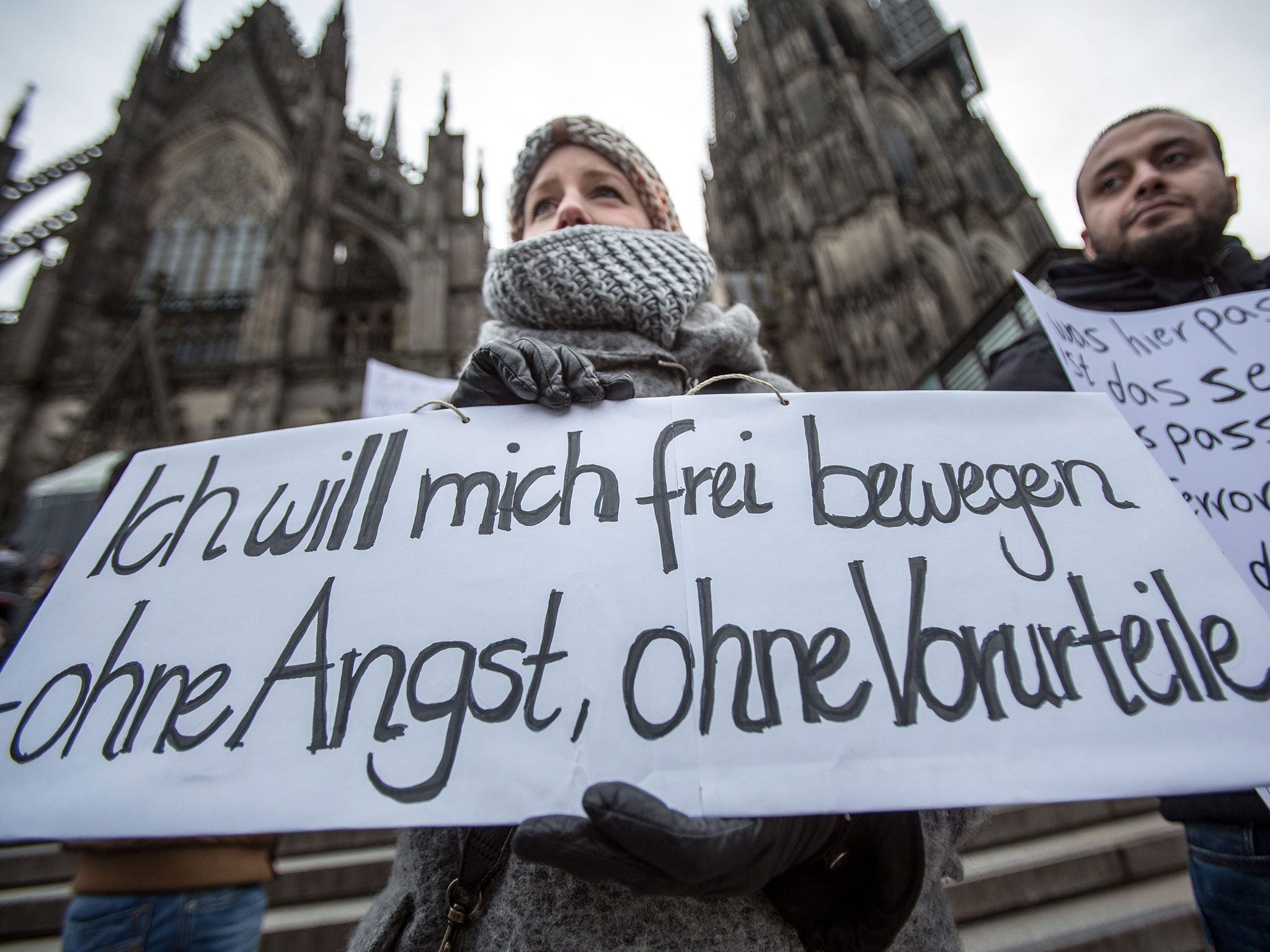 A protester’s sign reads: ‘I want to move freely – without fear, without prejudices'