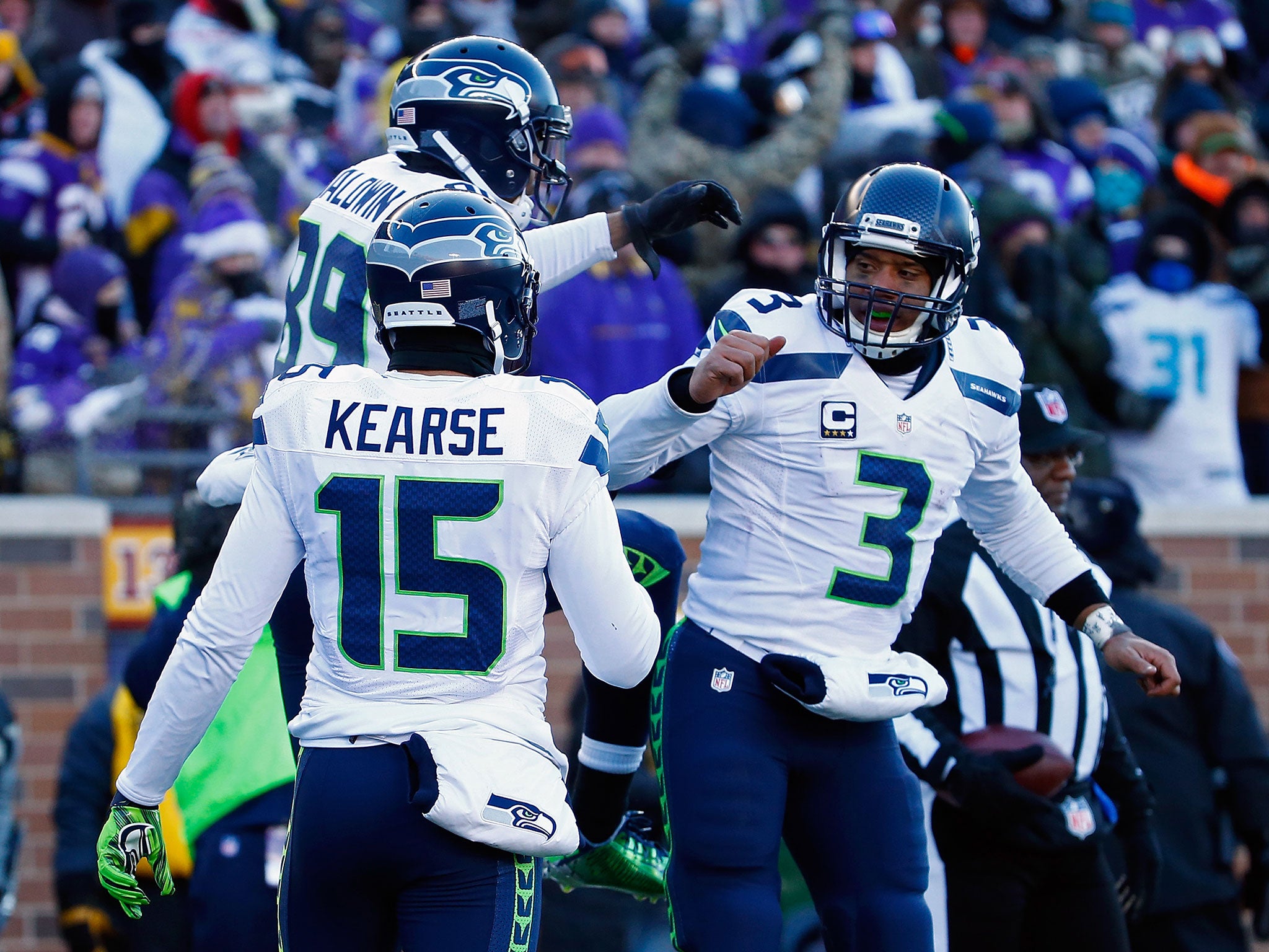 Russell Wilson (right) celebrates with Doug Baldwin after scoring a passing touchdown