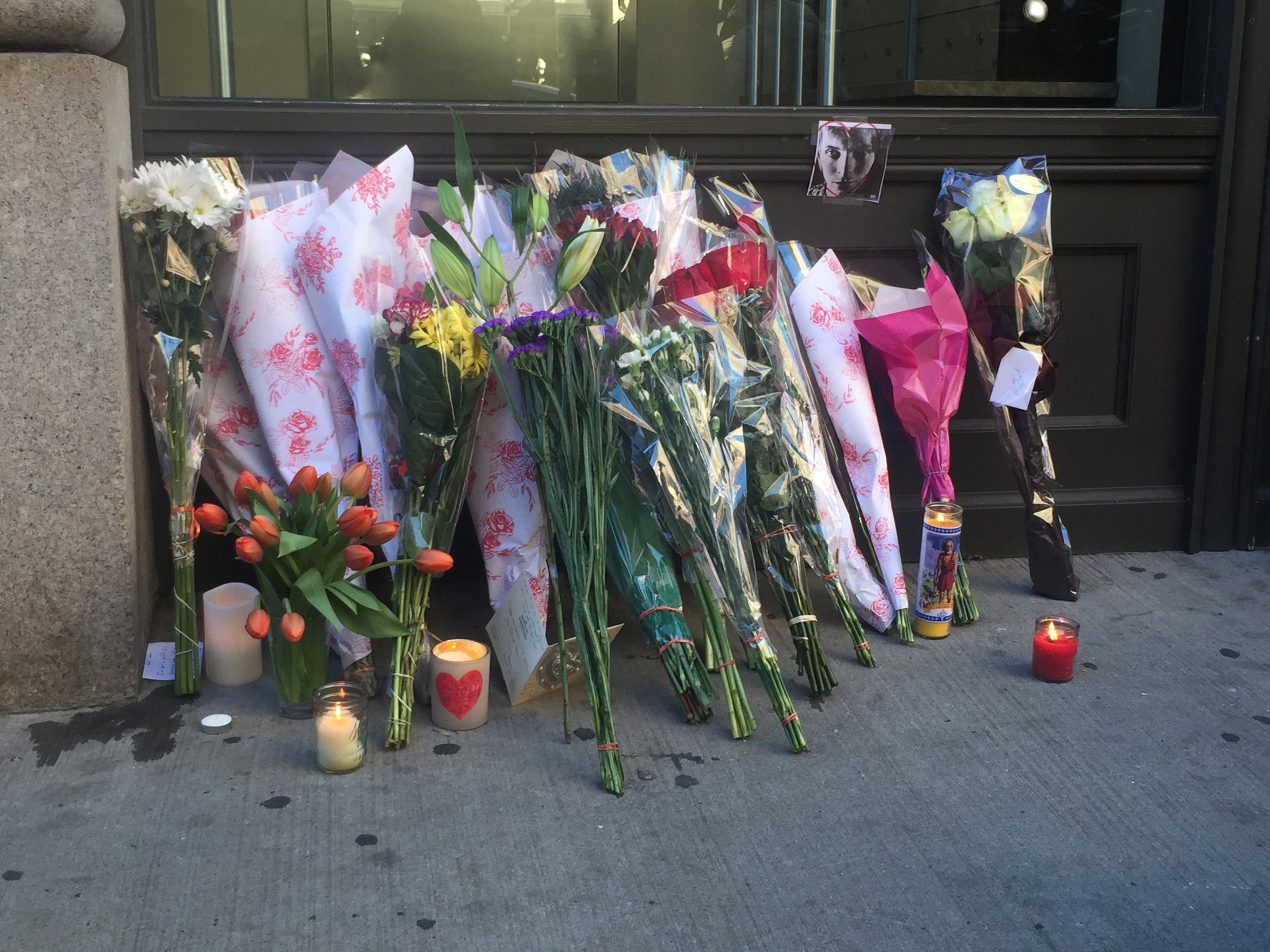 Fans place flowers outside Bowie's New York City apartment Justin Carissimo/The Independent