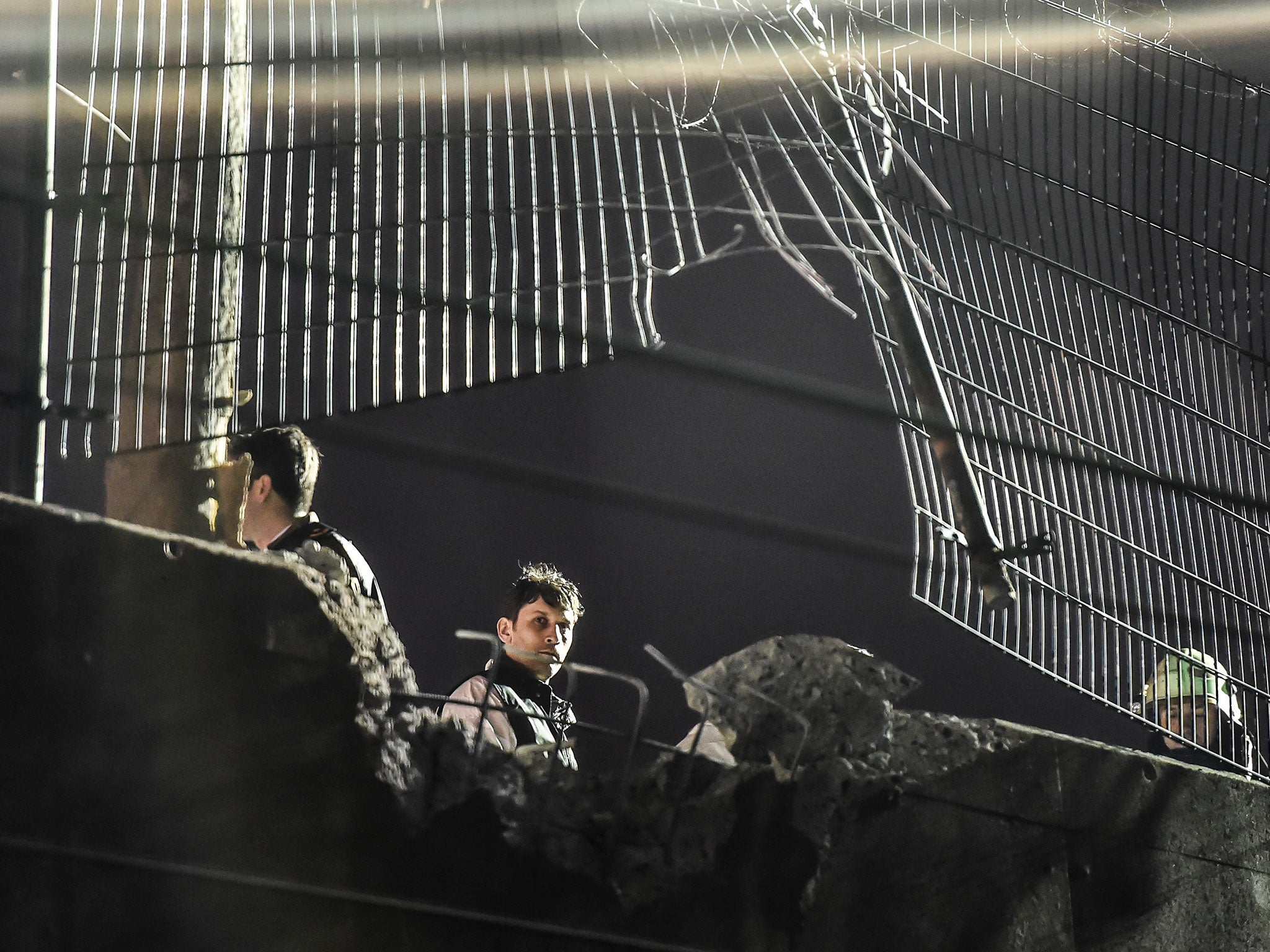 Forensic officers work at the site of an explosion on December 1 , 2015 at Bayrampasa district in Istanbul.