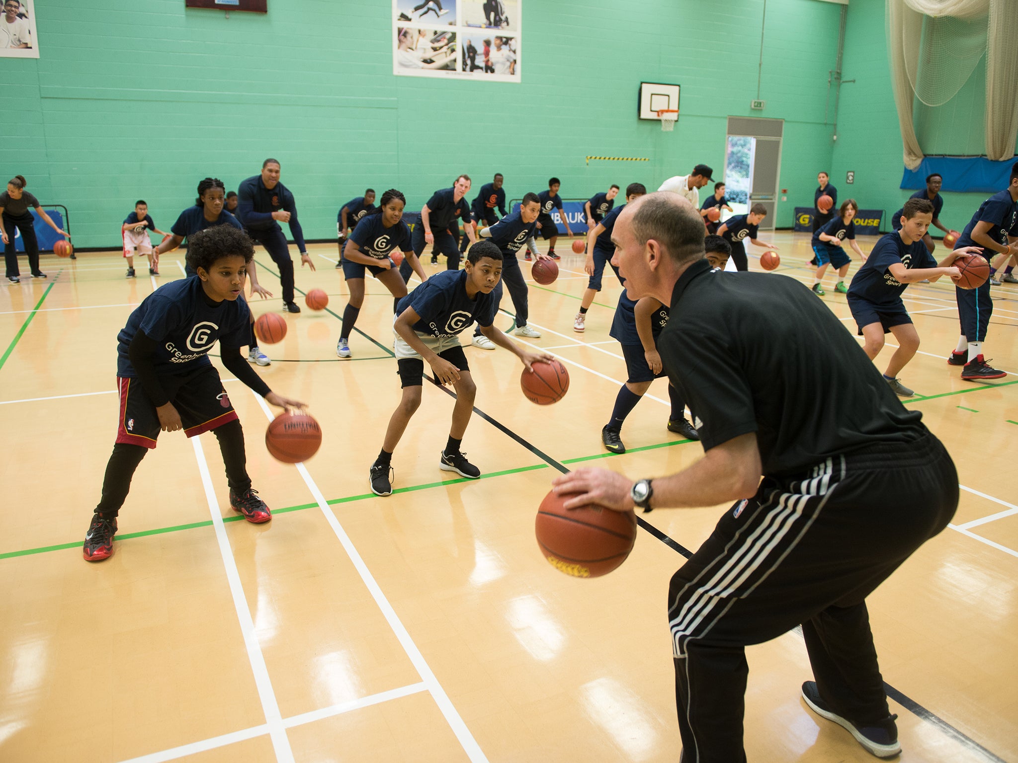 Former NBA coach Neal Meyer puts the kids through their paces