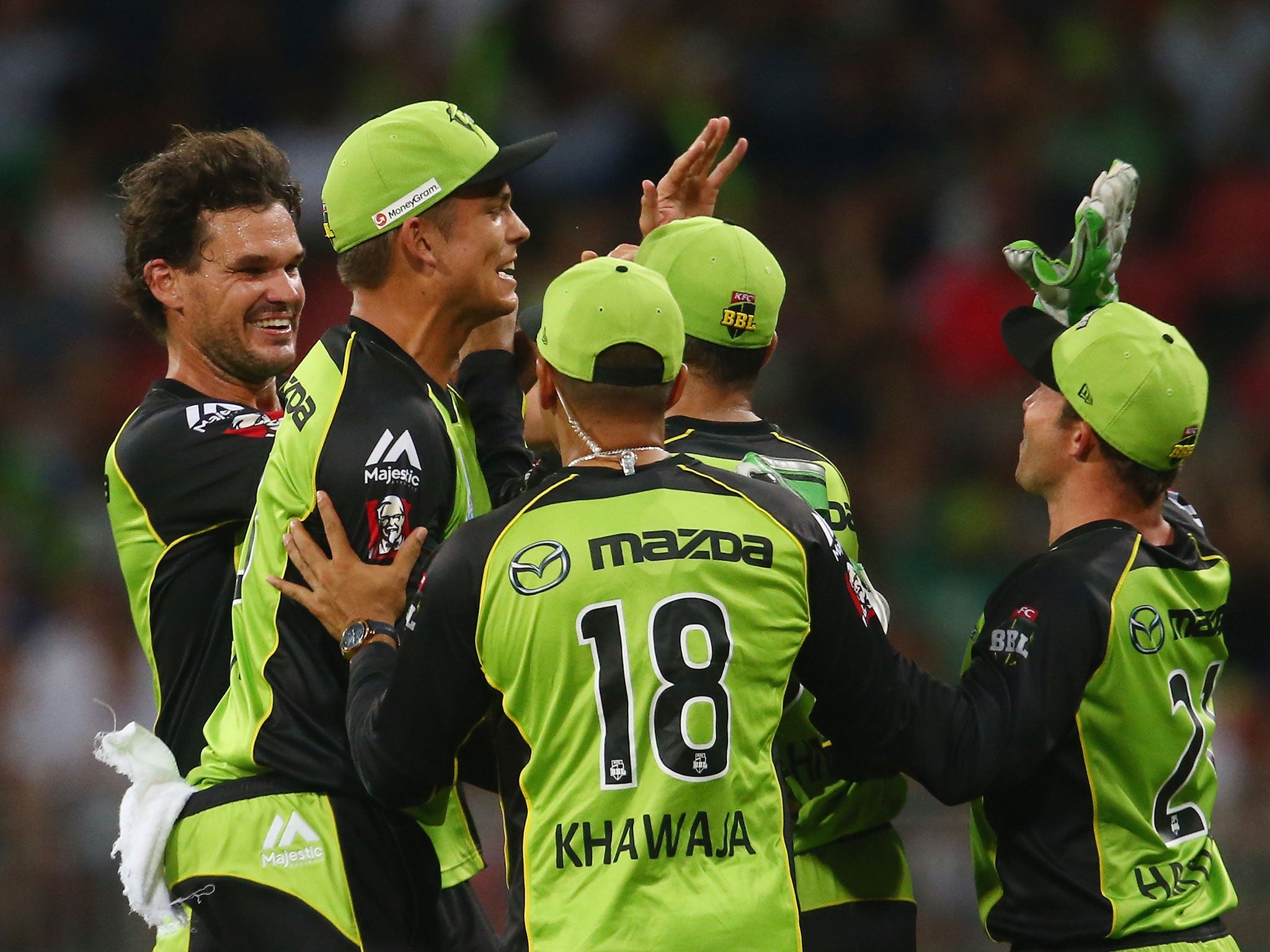 Clint McKay of the Sydney Thunder celebrates the wicket of Chris Gayle