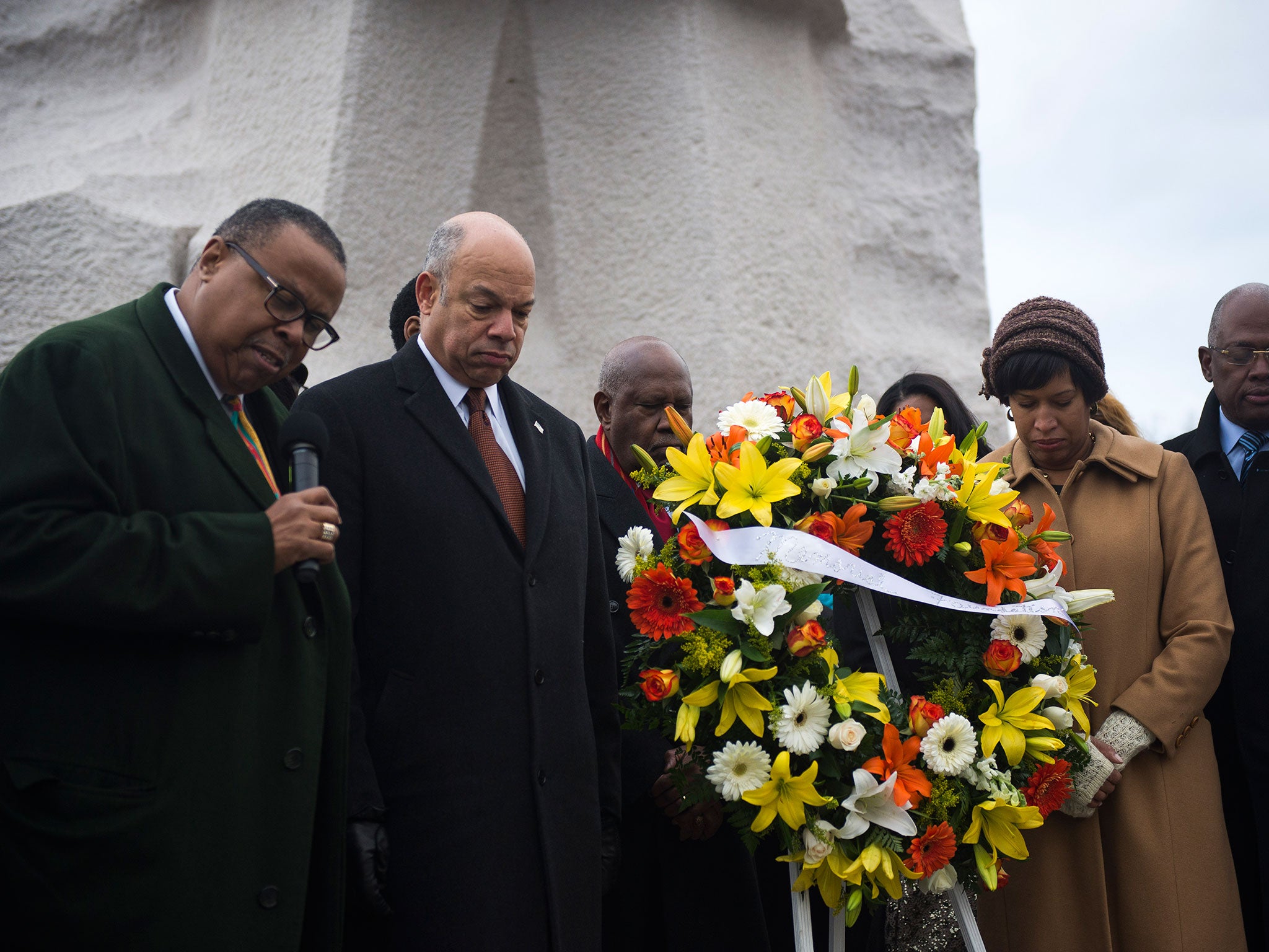 U.S. Secretary of Homeland Security and Washington DC Mayor along with President and CEO of the Martin Luther King Jr. Memorial Foundation. participate in a wreath laying at the Martin Luther King Jr. Memorial during a ceremony on the National Mall in Washington, D.C. in 2015