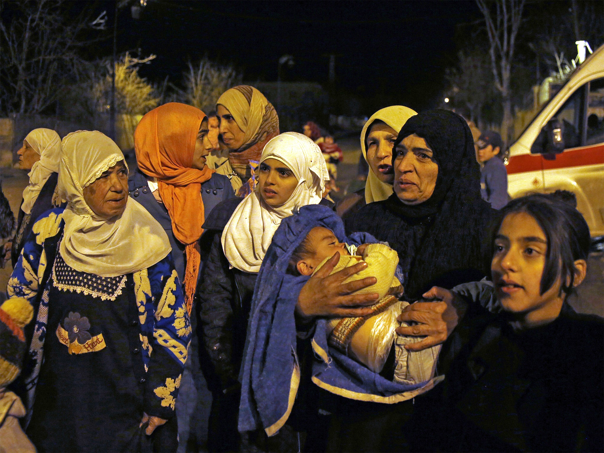 Citizens wait to leave the besieged town of Madaya, northwest of Damascus. The UN says 400 people still need to be evacuated immediately