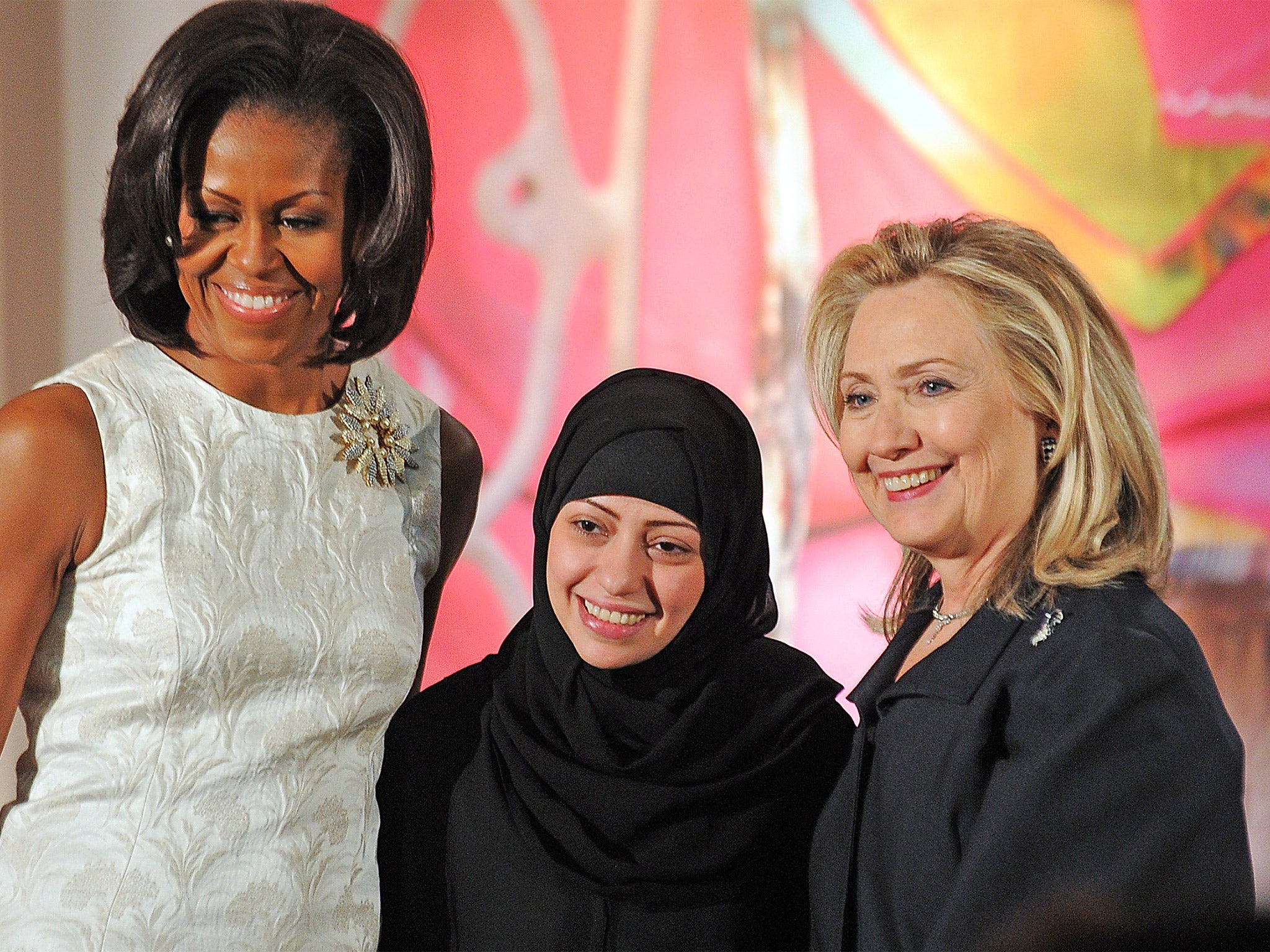 Samar Badawi with Michelle Obama and Hillary Clinton