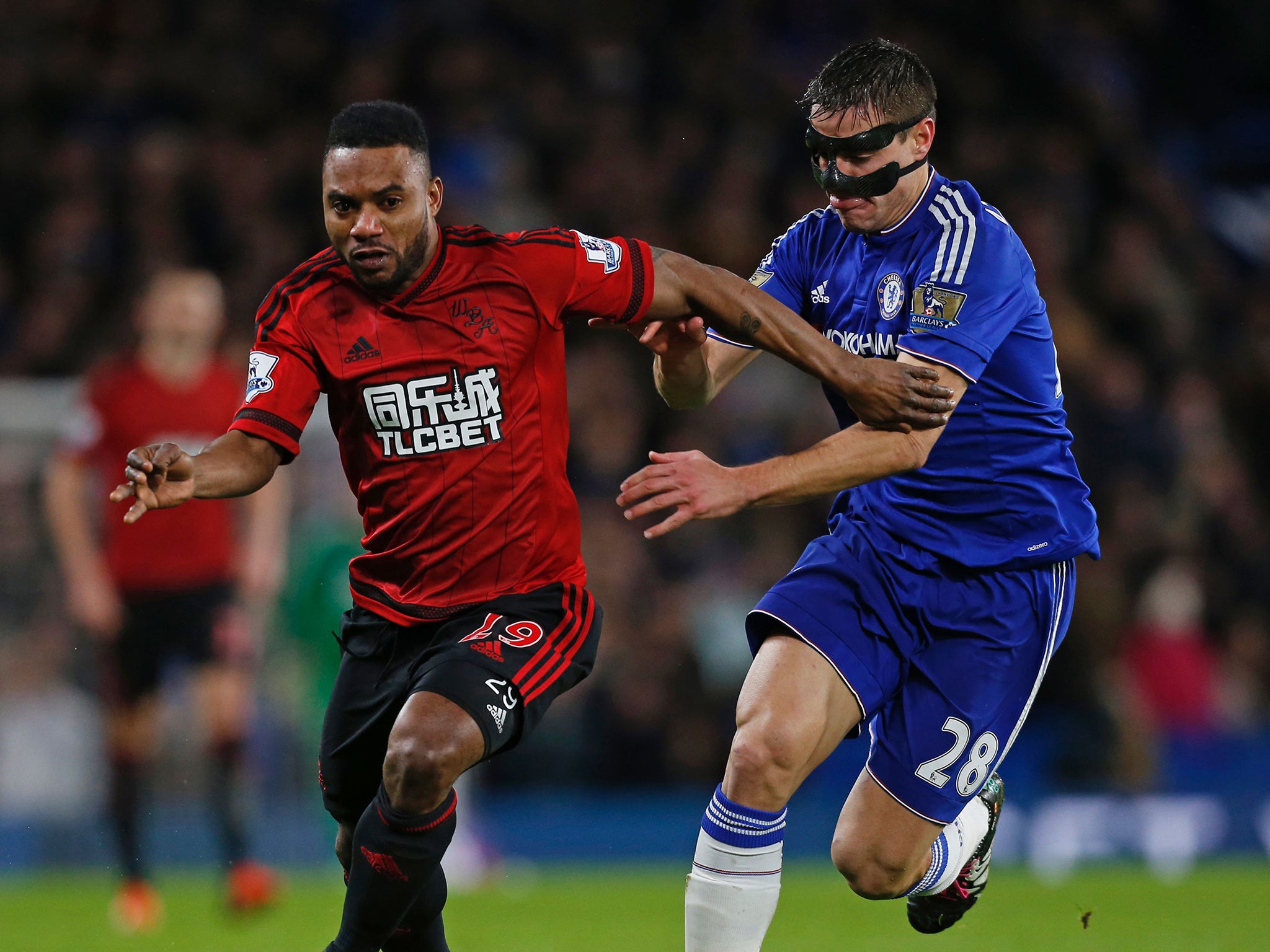 West Bromwich Albion's Stephane Sessegnon competes with Chelsea's Cesar Azpilicueta for the ball