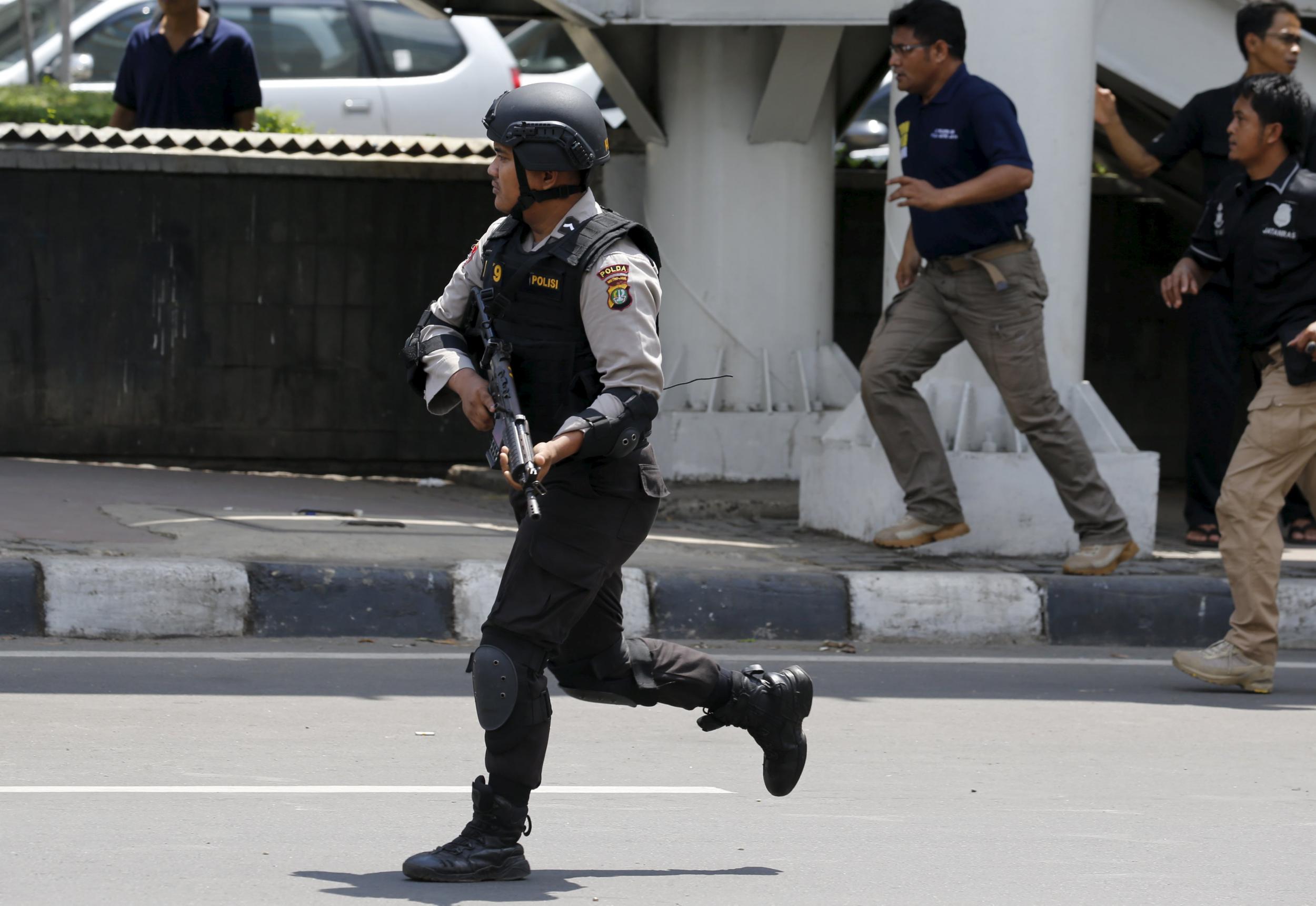 An Indonesian policeman near the site of a blast