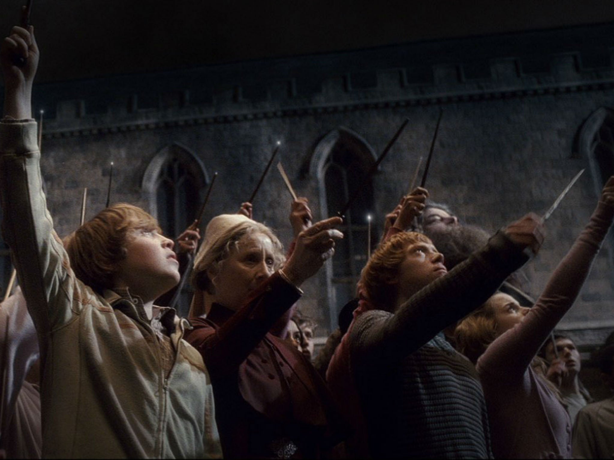 Harry Potter students raise their wands after the death of Albus Dumbledore