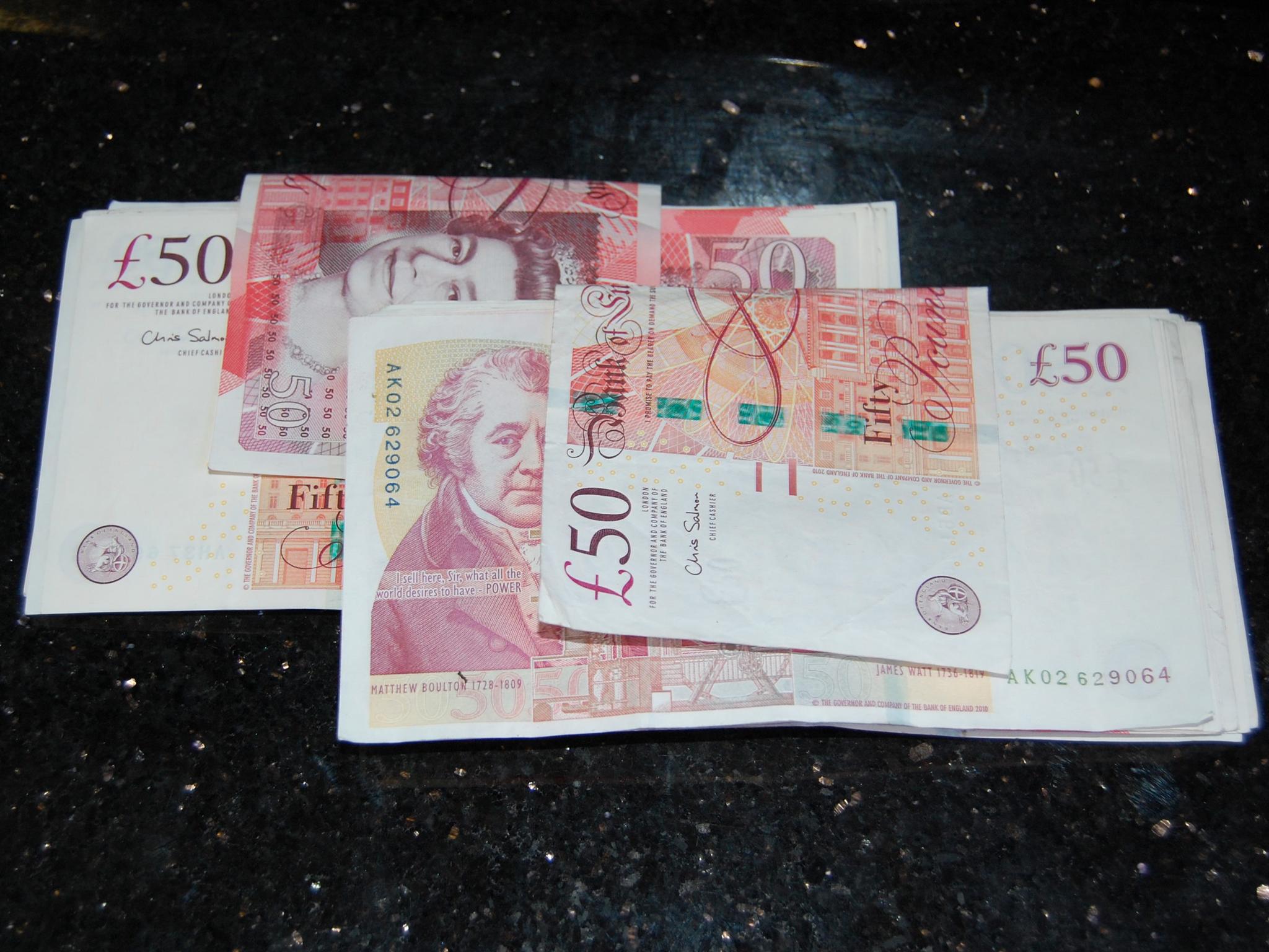 Quantity of banknotes found under microwave in the kitchen at Winkley Street