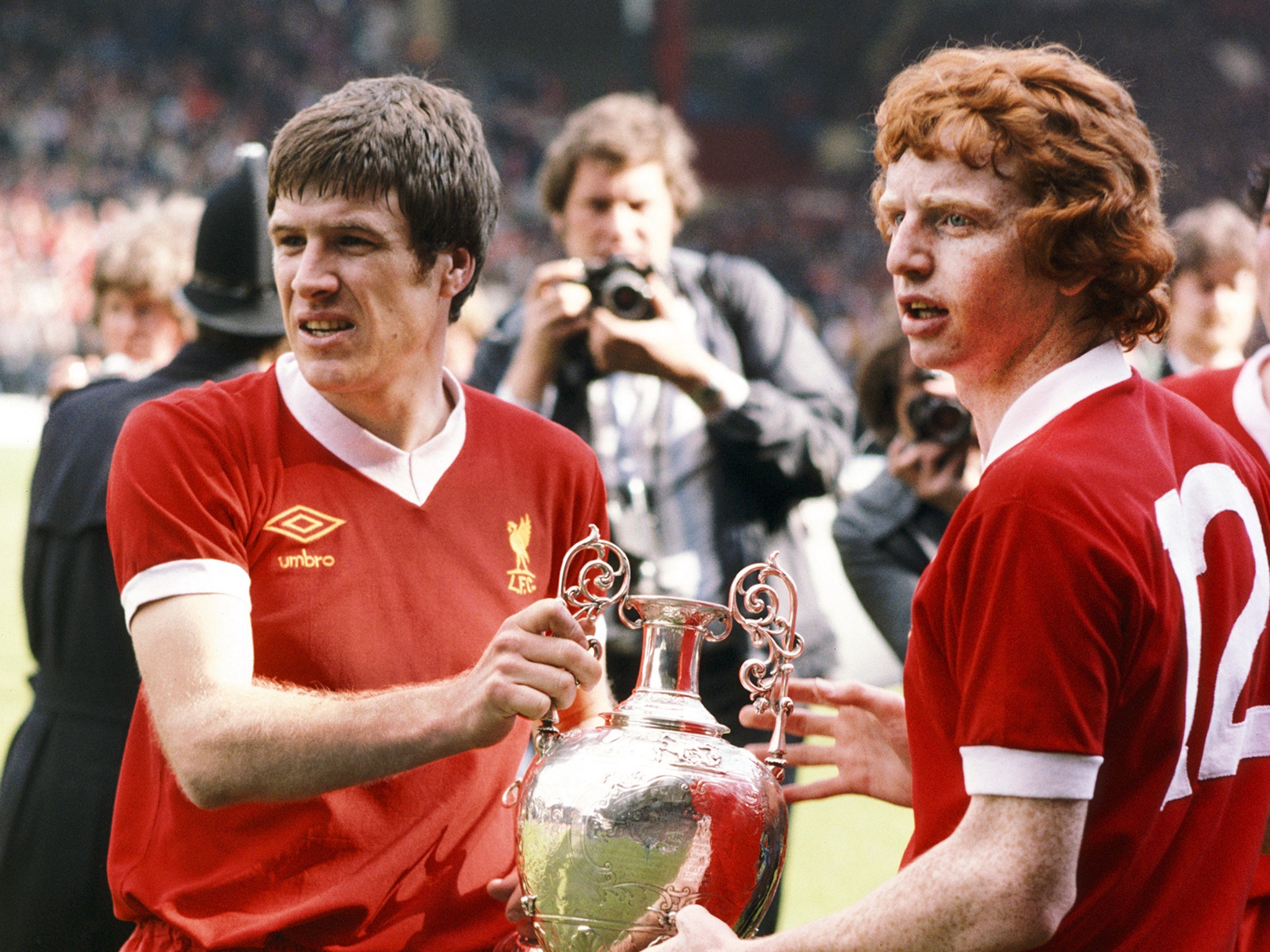 Liverpool's Emlyn Hughes and David Fairclough with the First Division trophy in 1977