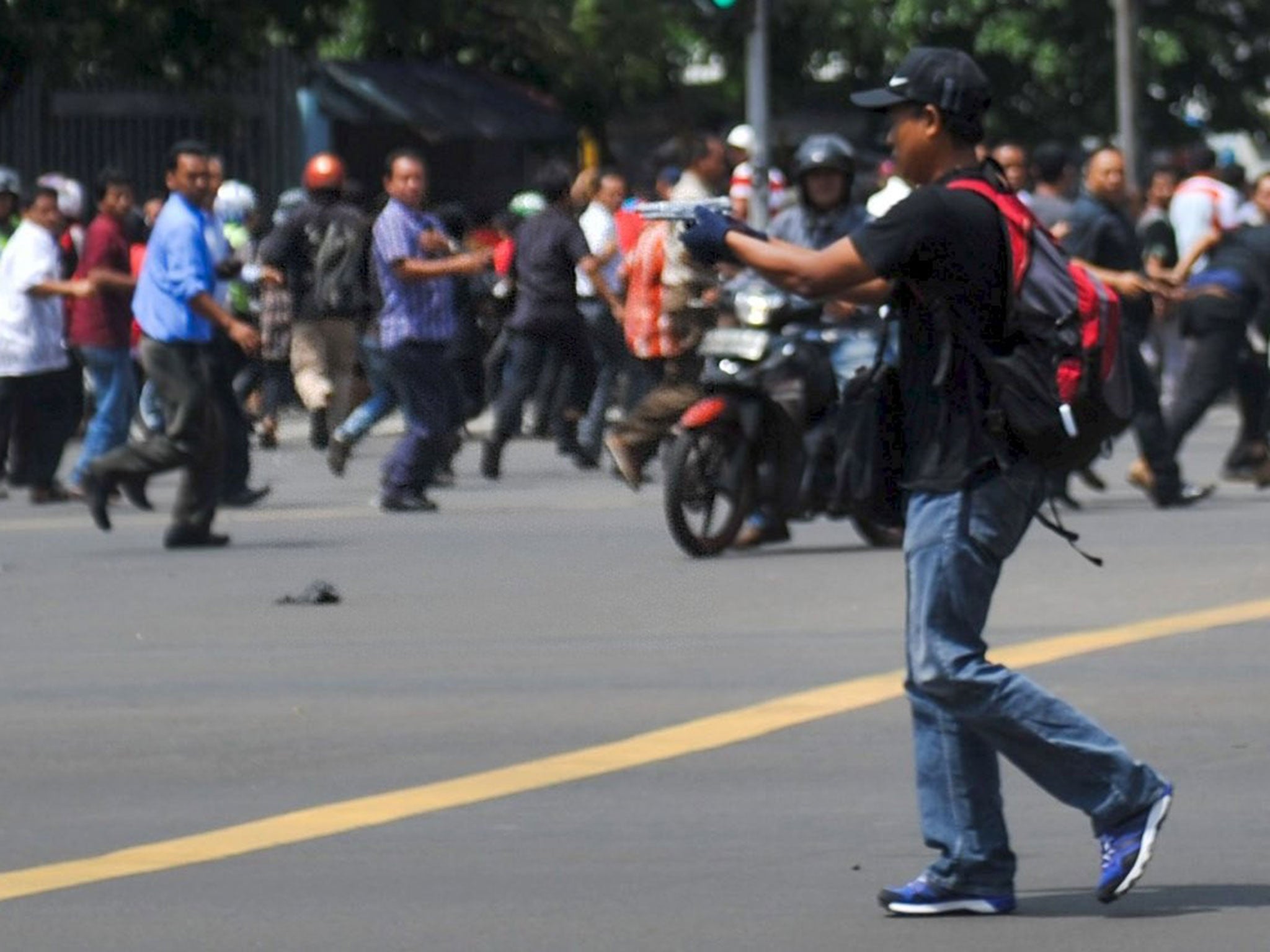 The gunman is seen firing into the crowd