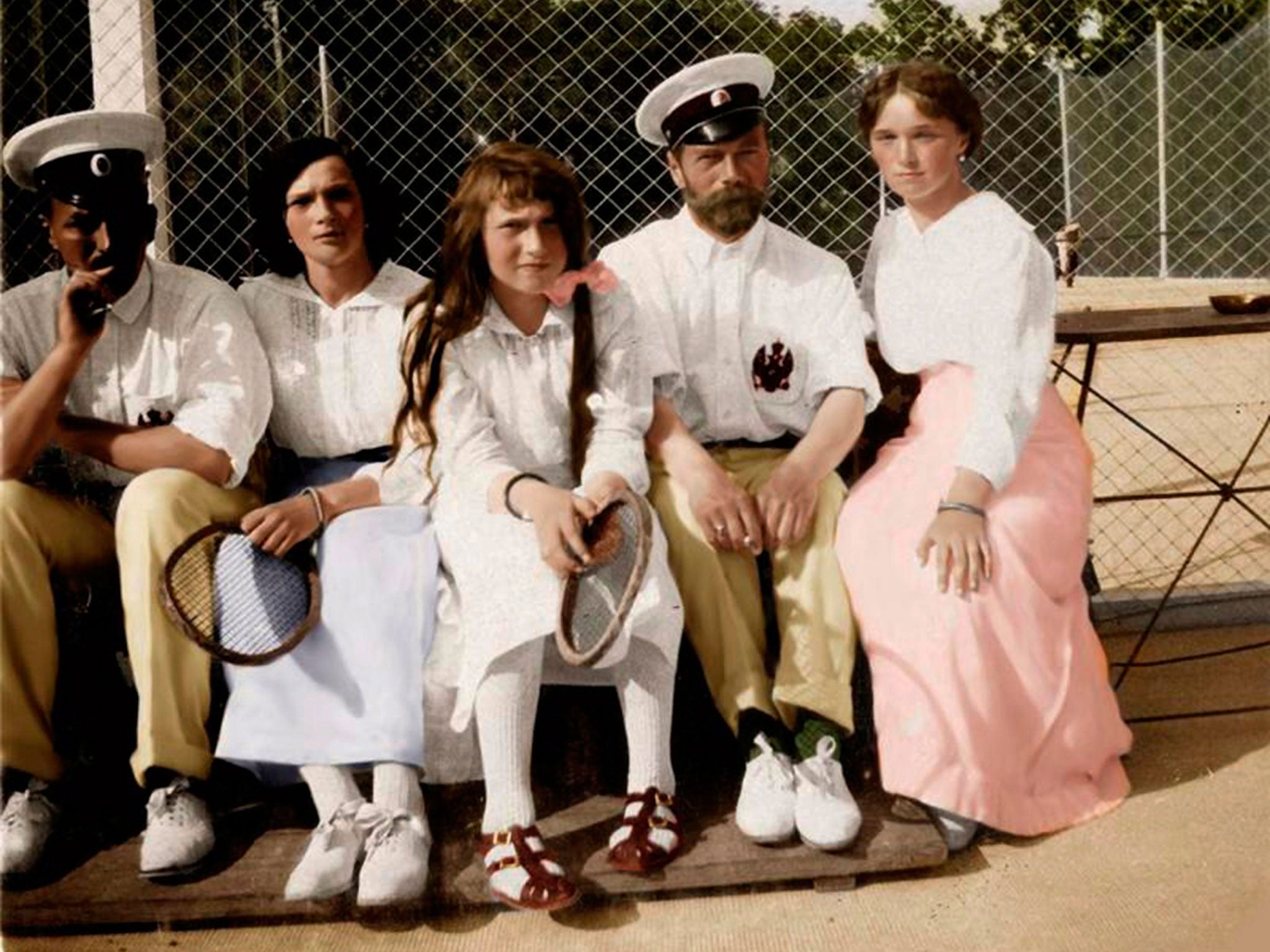 A conventional history: Tsar Nicholas II with his children on a tennis court