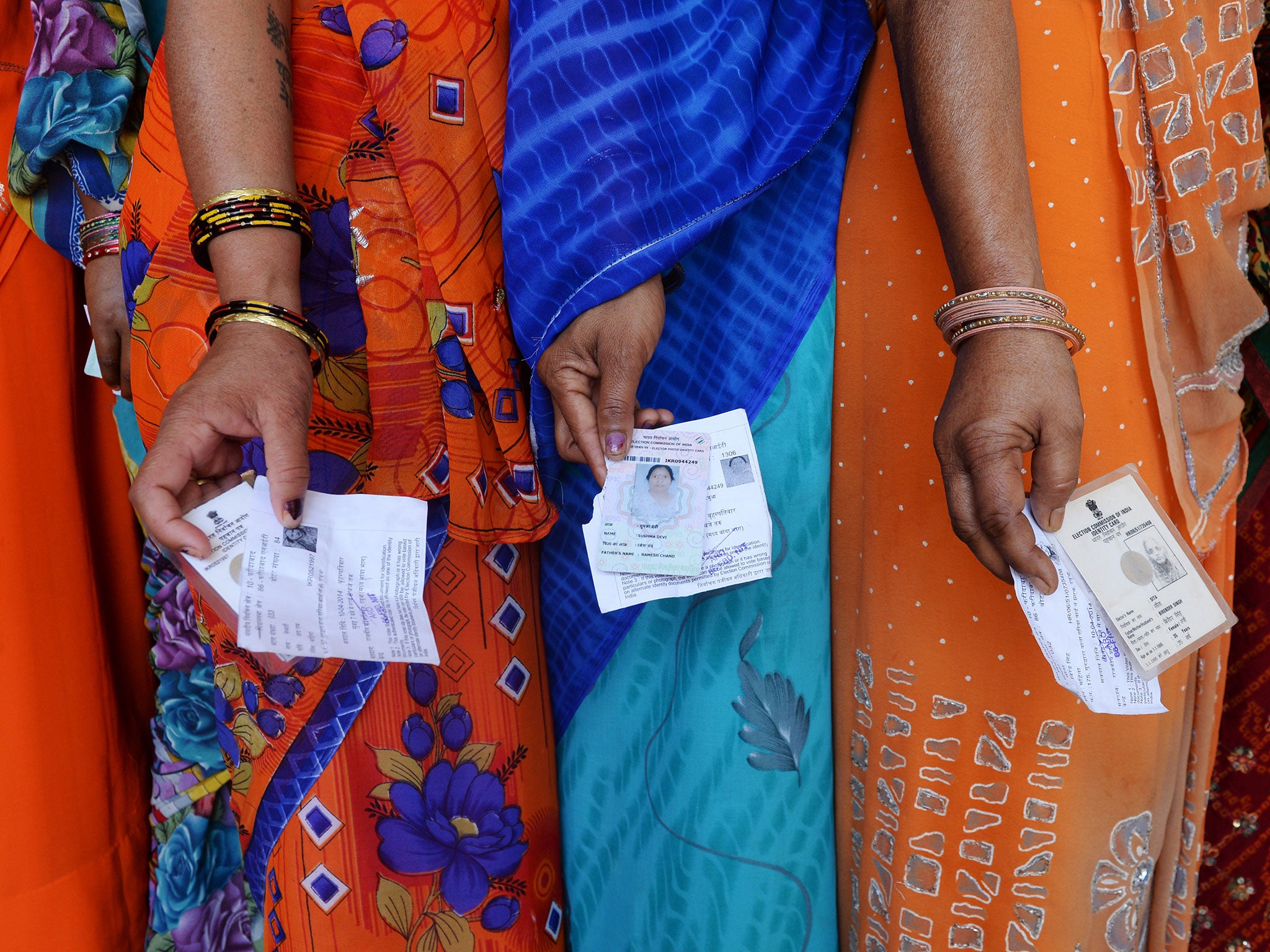 &#13;
Women voters in a line outside a polling station at Dabua village on the outskirts of Faridabad, Haryana&#13;