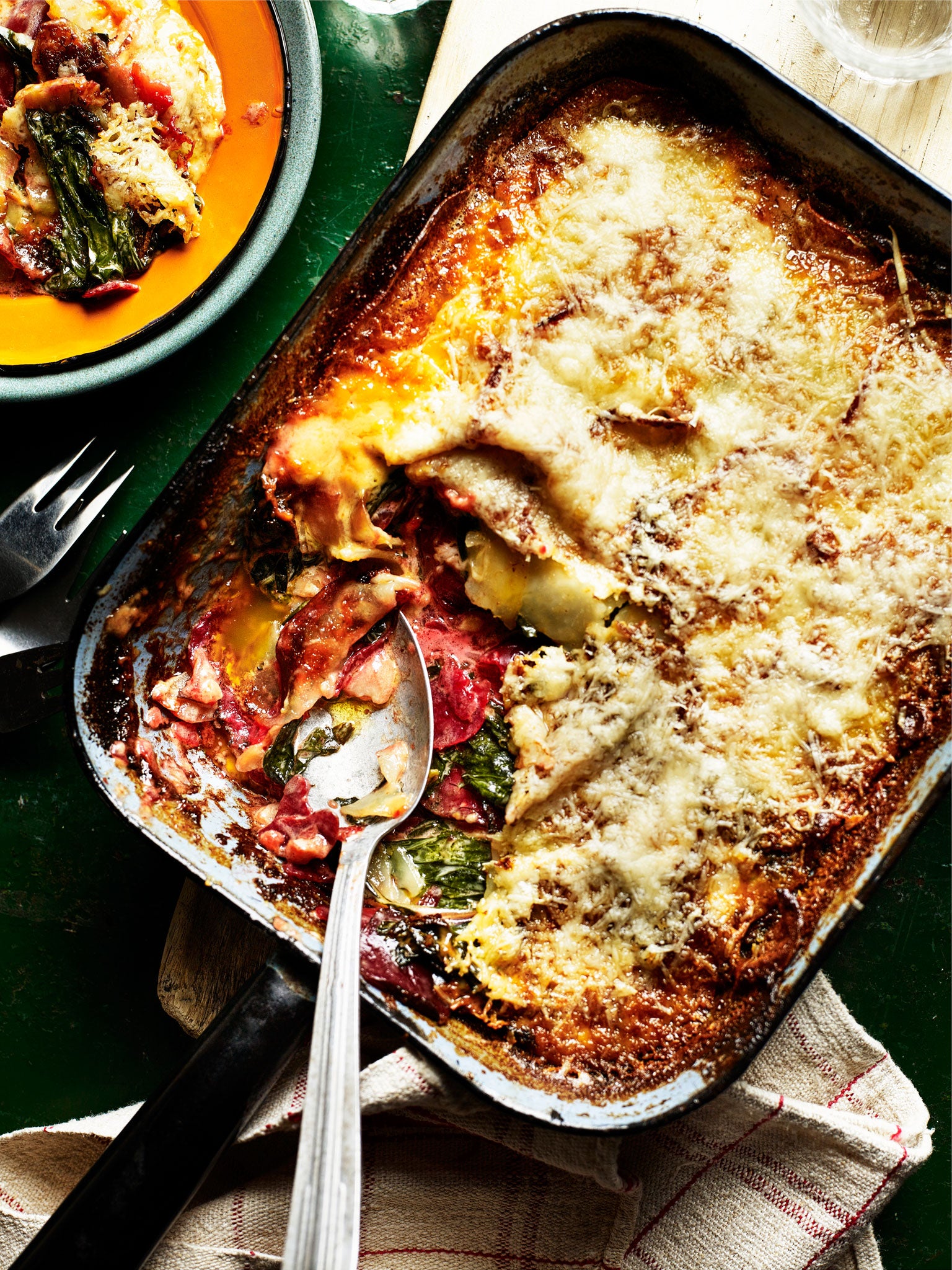 Potato and beetroot gratin with chard and manchego