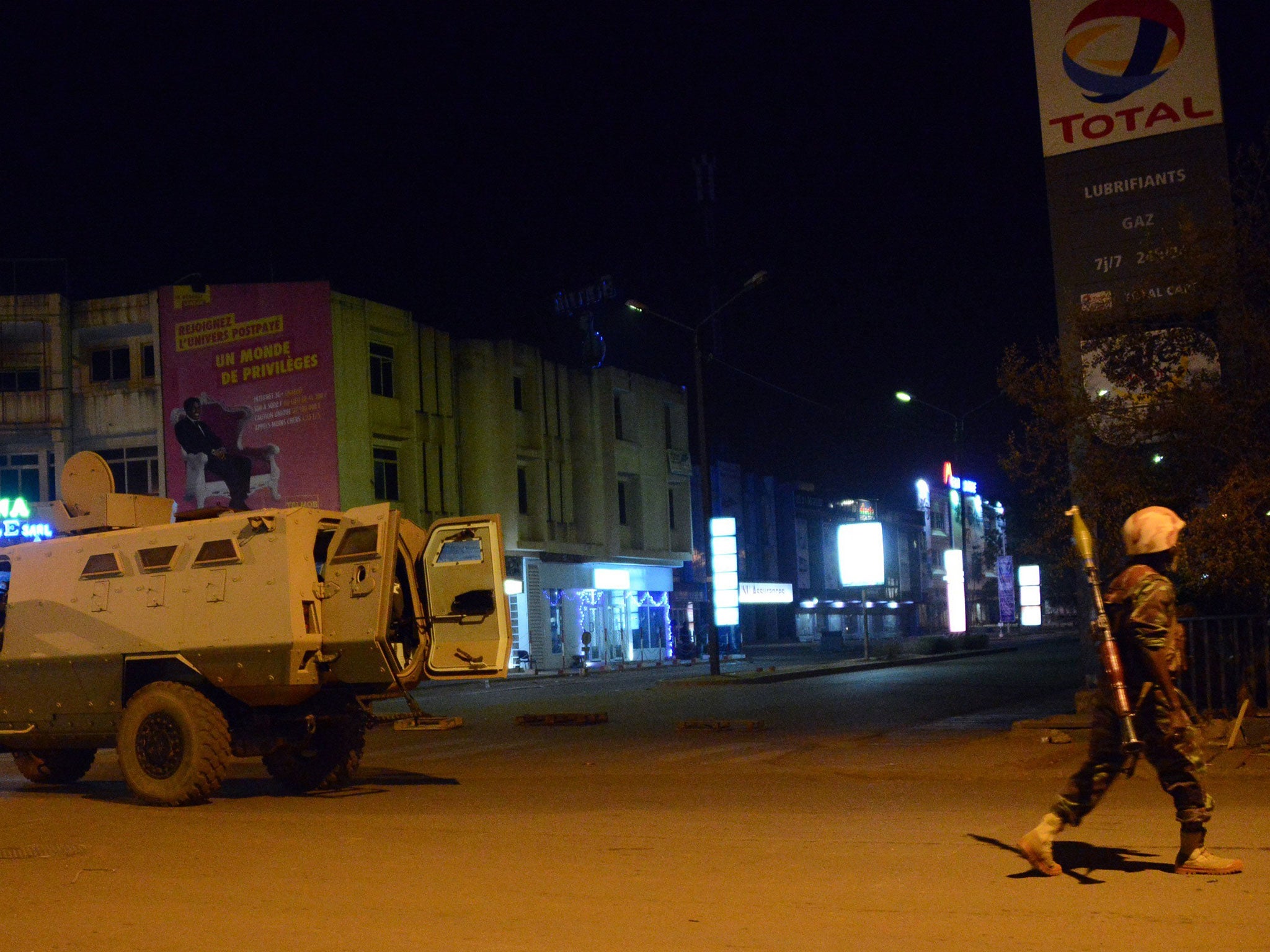 Army forces drive near Hotel Splendid where the attackers remain with sporadic gunfire continuing in Burkina Faso's capital Ouagadougou on Jnauary 15, 2016.