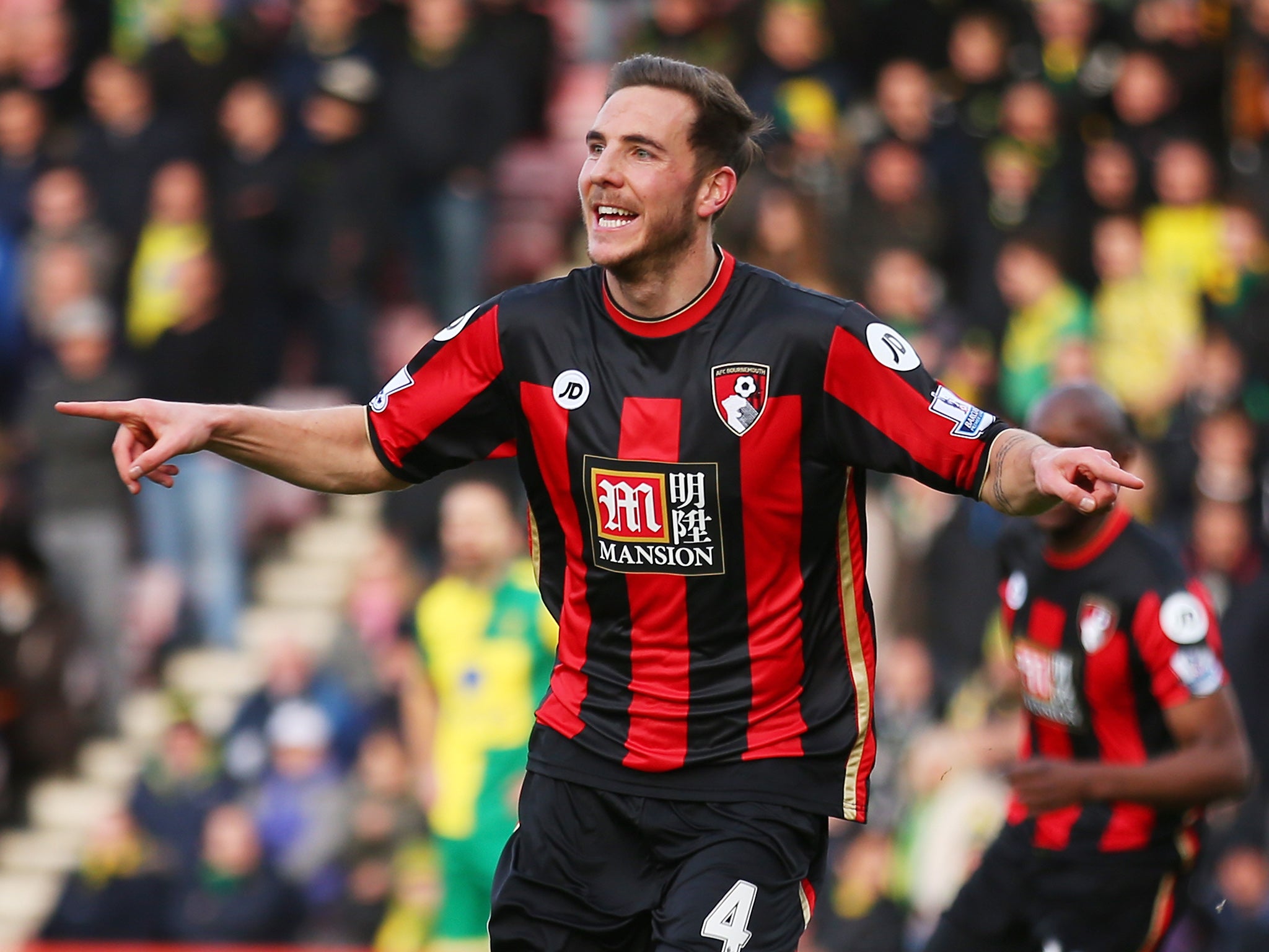 Dan Gosling celebrates opening the scoring at the Vitality Stadium