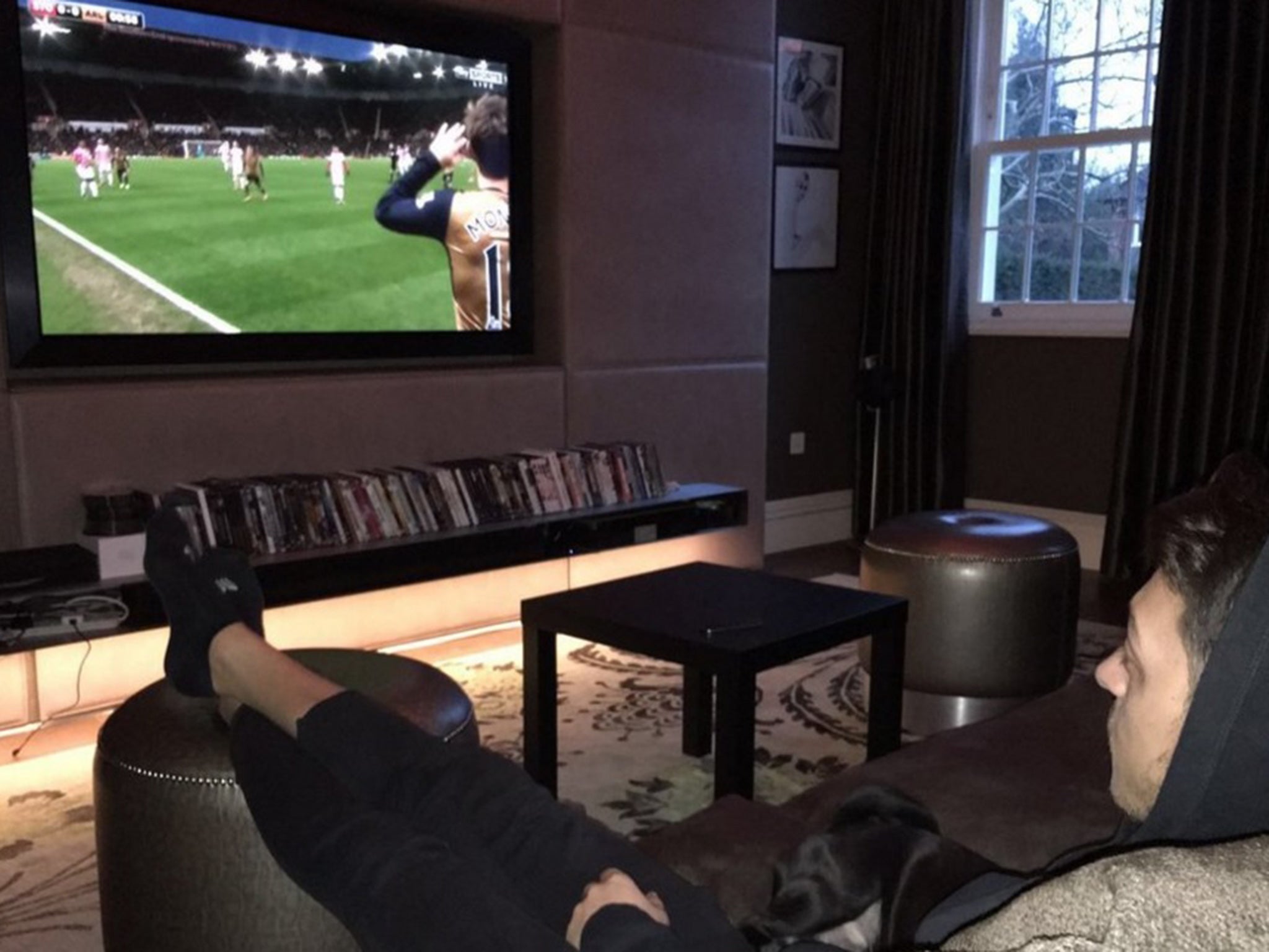 Mesut Ozil watches from home