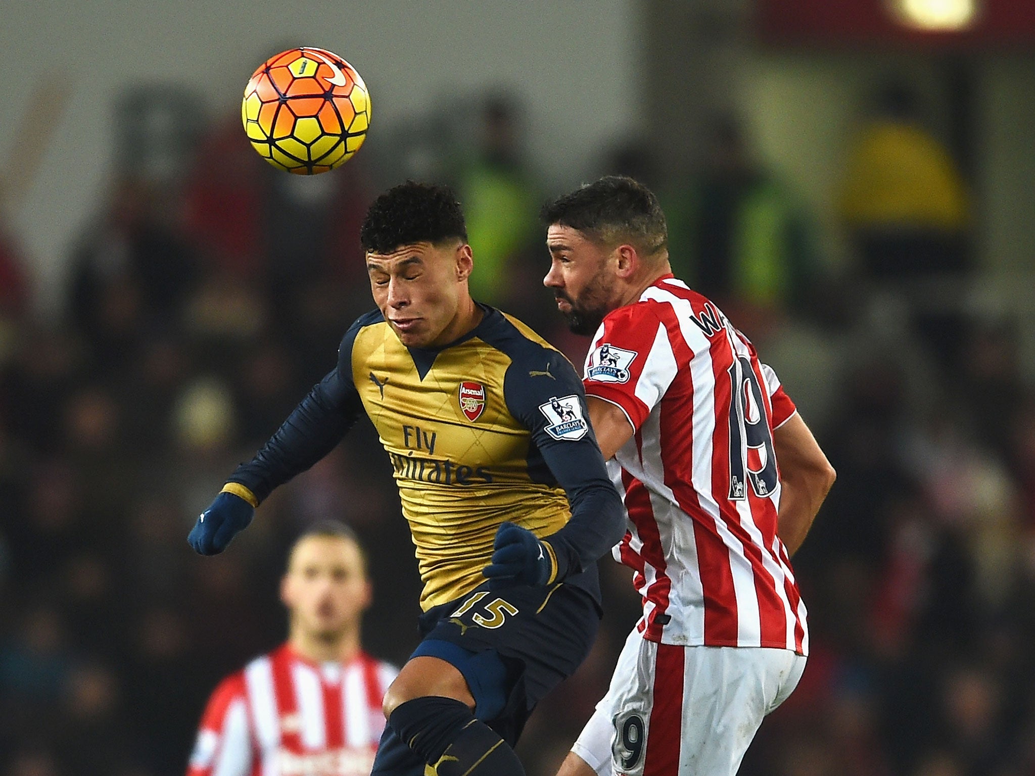 Alex Oxlade-Chamberlain competes for the ball