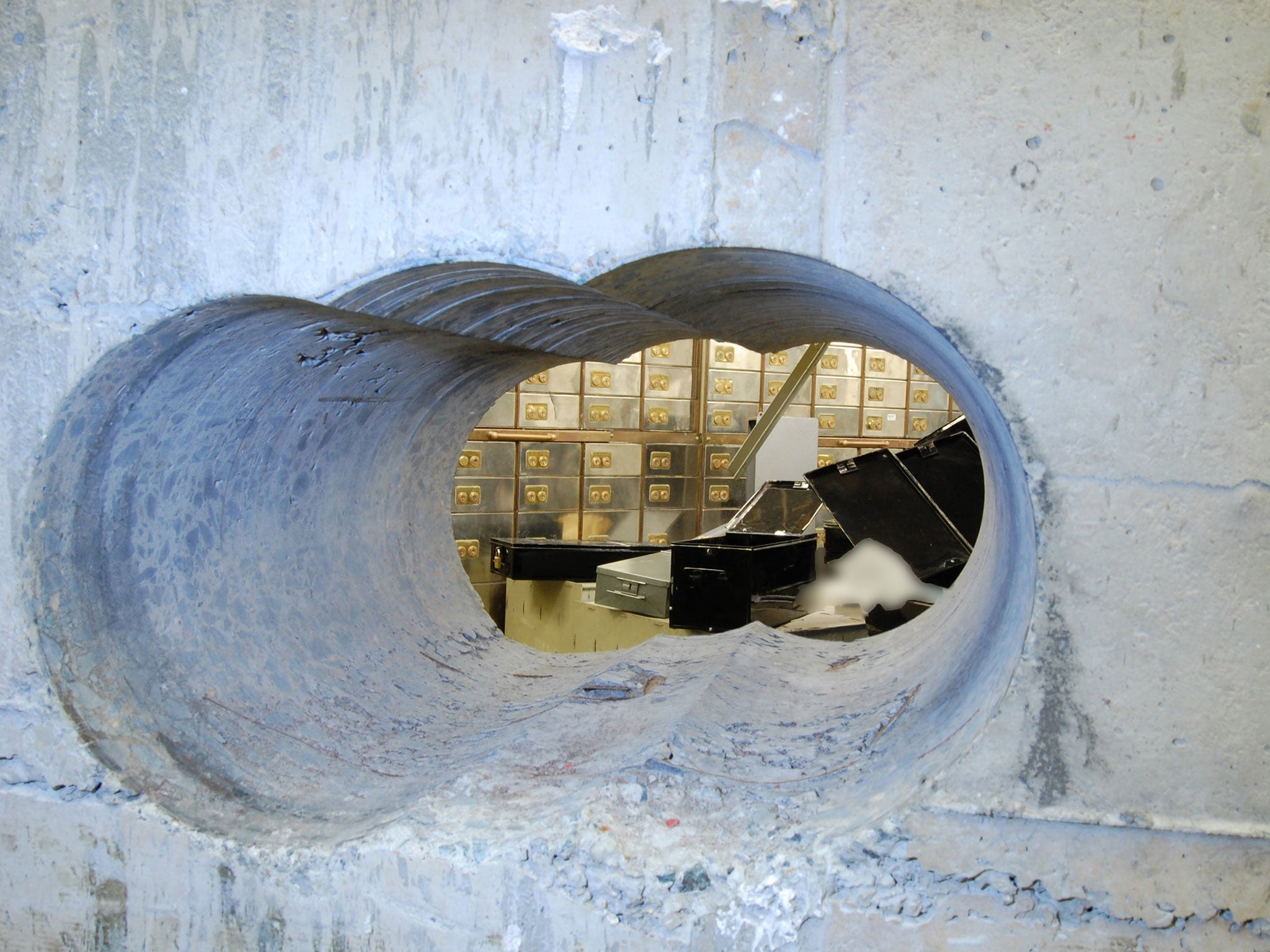 The hole drilled in the vault wall during the raid of Hatton Garden Safe Deposit Ltd