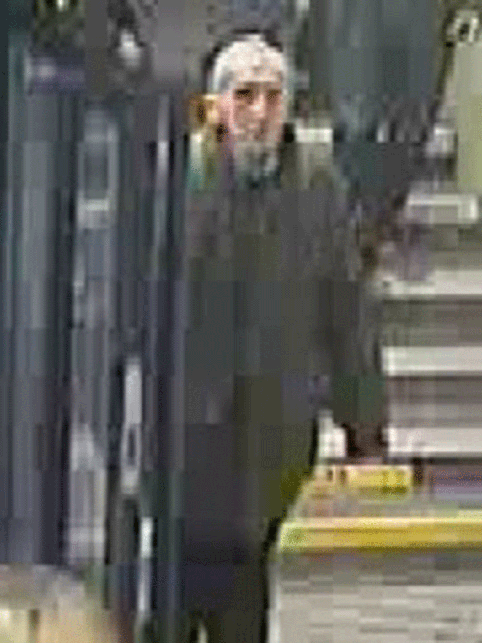 Greater Manchester Police released CCTV images of the unidentified man at Ealing Broadway station in London