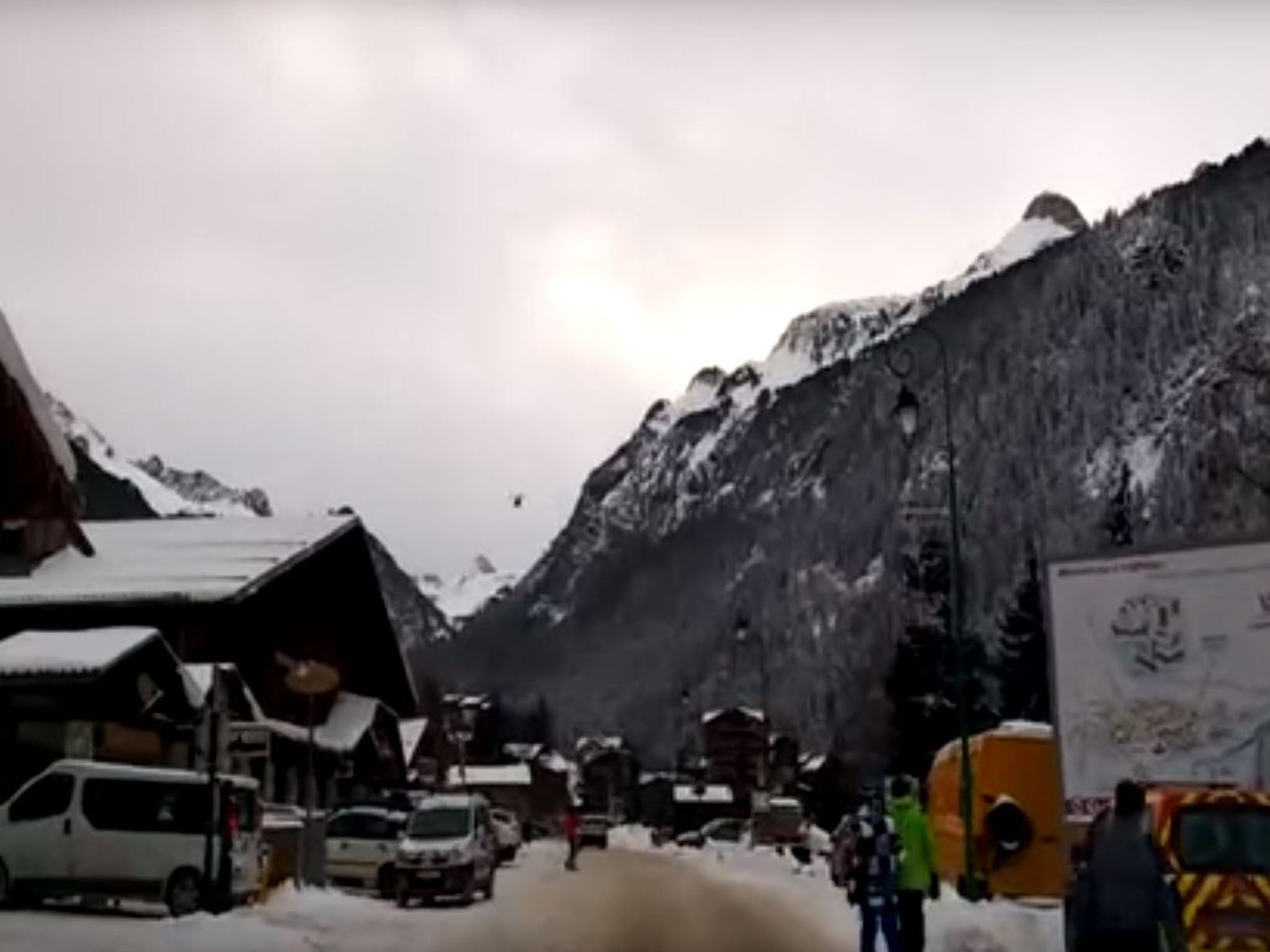 A helicopter flies off to join the rescue operation in Savoie in the French Alps where five soldiers were killed in an avalanche