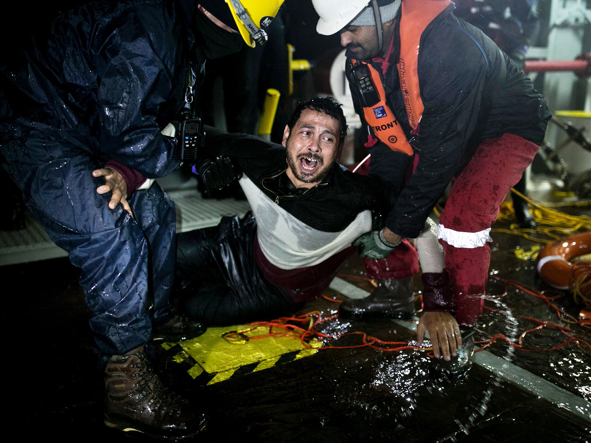 Ahmad Zarour, 32, from Syria, reacts after his rescue by MOAS (Migrant Offshore Aid Station) while attempting to reach the Greek island of Agathonisi, Dodecanese, southeastern Agean Sea