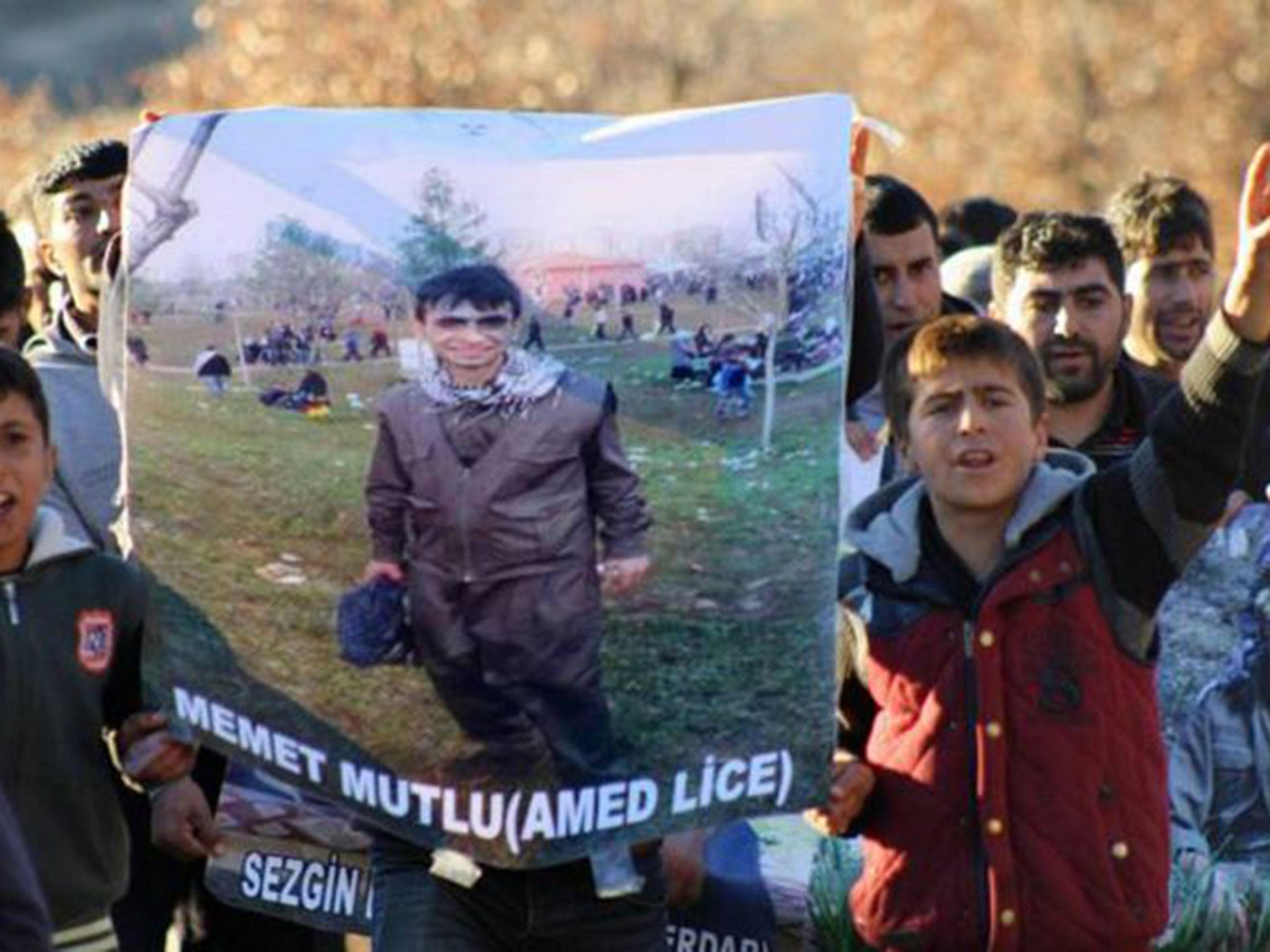 The funeral of 16-year-old Mehmet Mutlu. There are claims that he was shot while his hands were cuffed behind his back