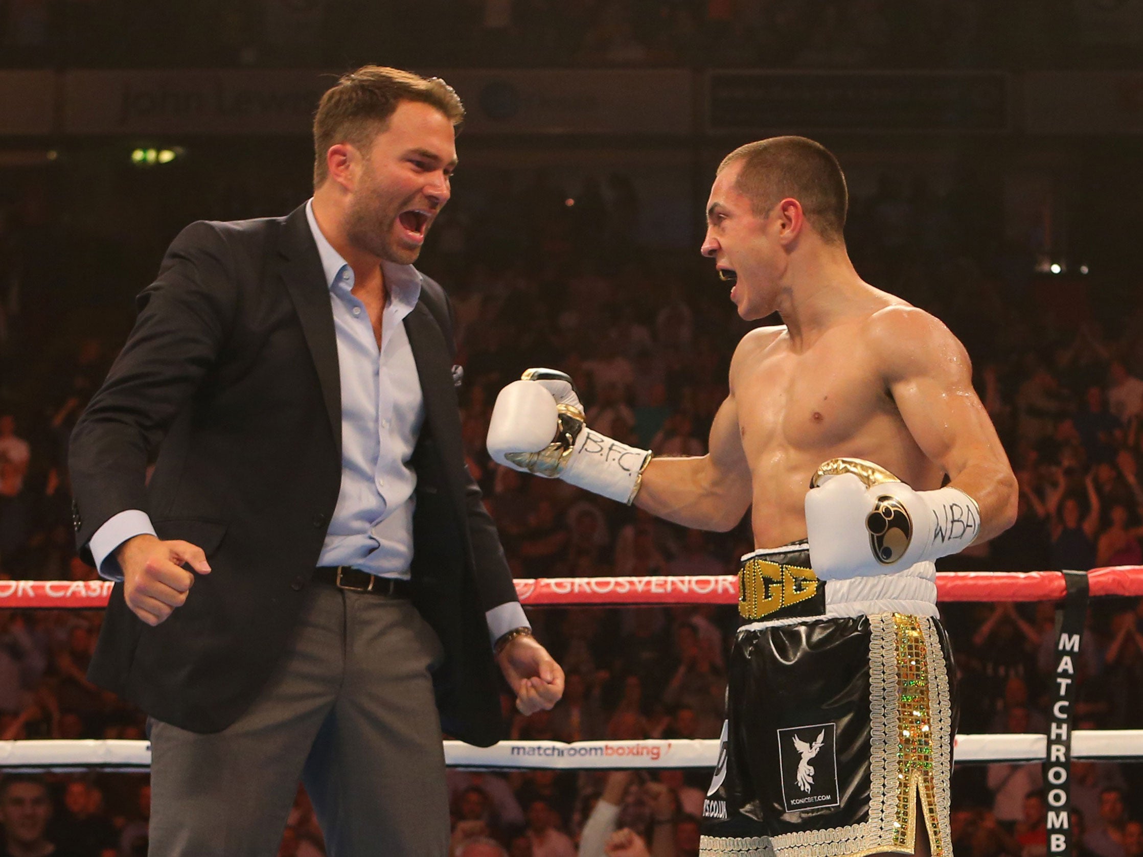 &#13;
Scott Quigg, right, celebrates his win over Kiko Martinez with promoter Eddie Hearn&#13;