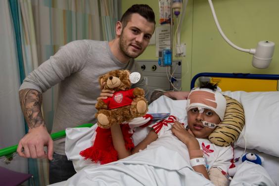 Wilshere with 12-year-old Humza Hussein