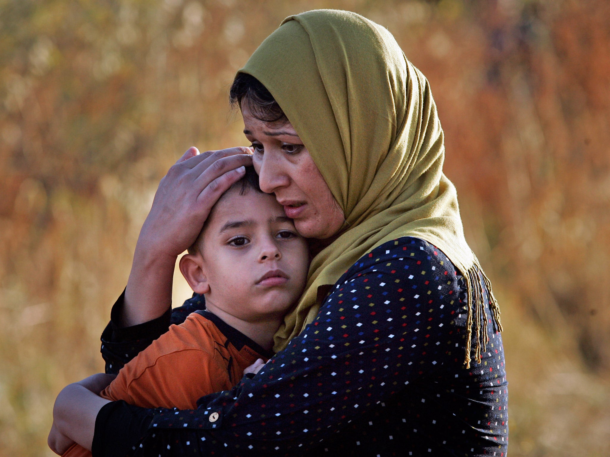 A Syrian mother and her child, shortly after arriving at a beach on the Greek island of Kos, last summer