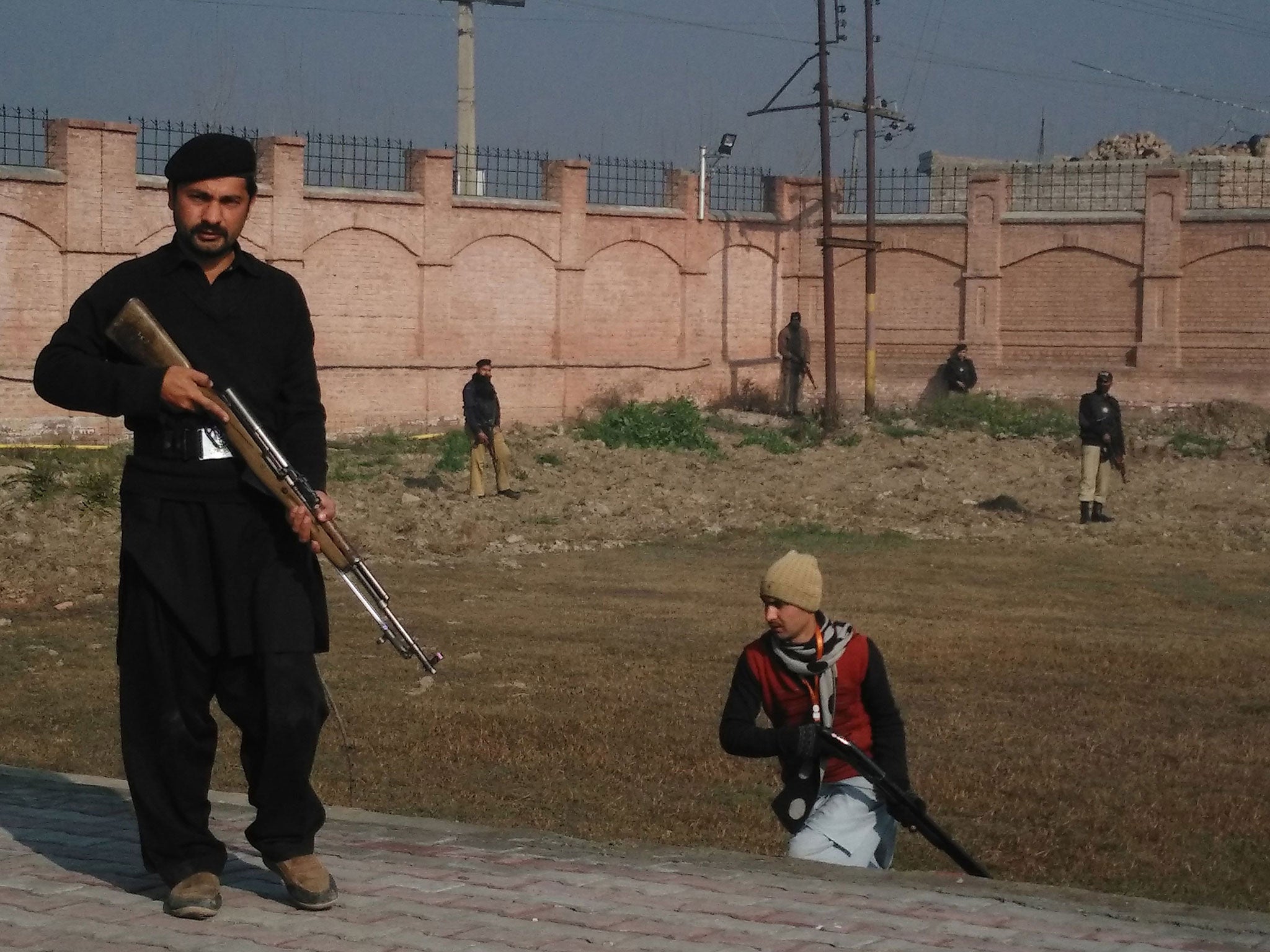 Security personnel take up positions outside the university